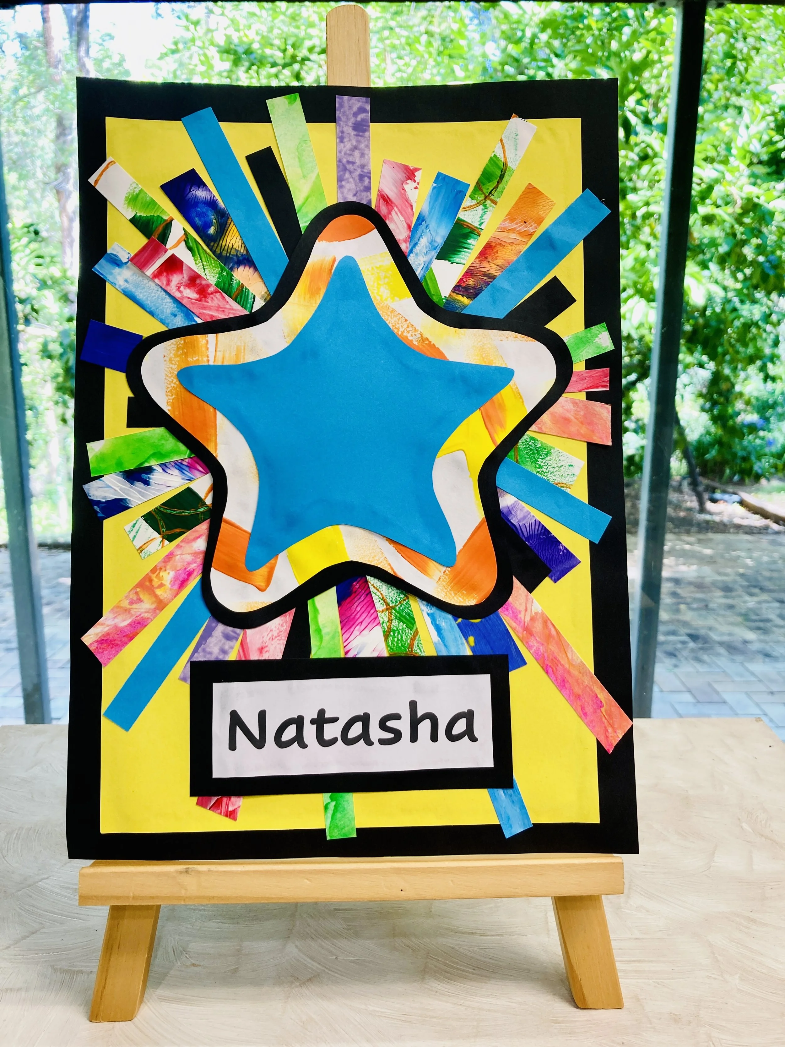 Paper collage name plate on easel.jpg