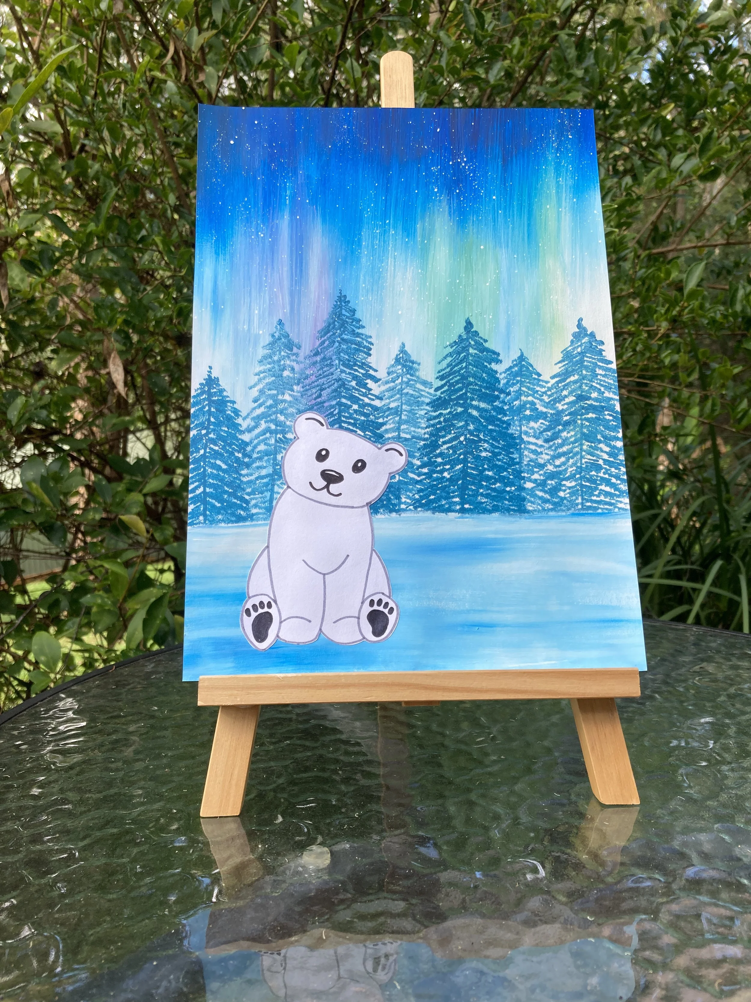 Northern Lights Polar Bear painting on easel.JPG