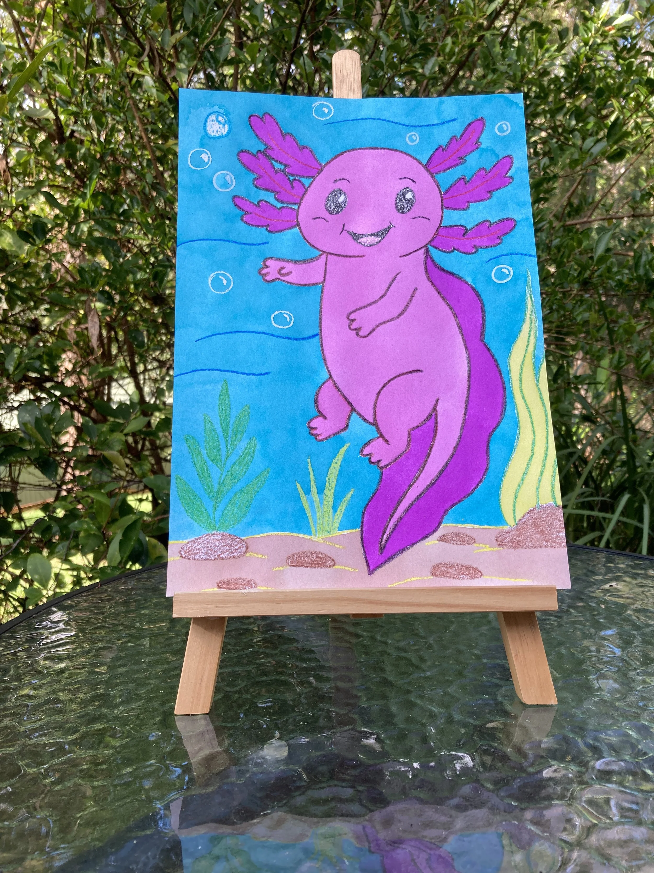 Adorable Axolotl painting on easel.JPG