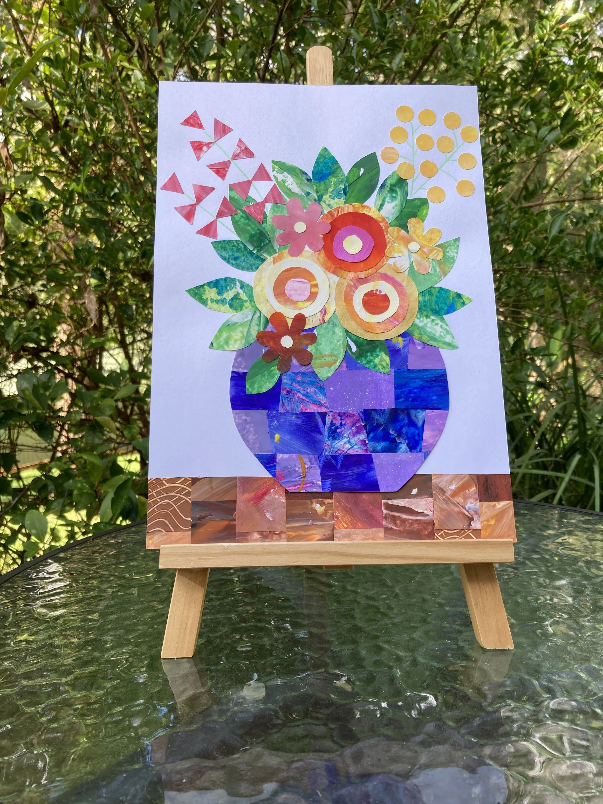 Painted Paper Flowers artworks on easel.JPG
