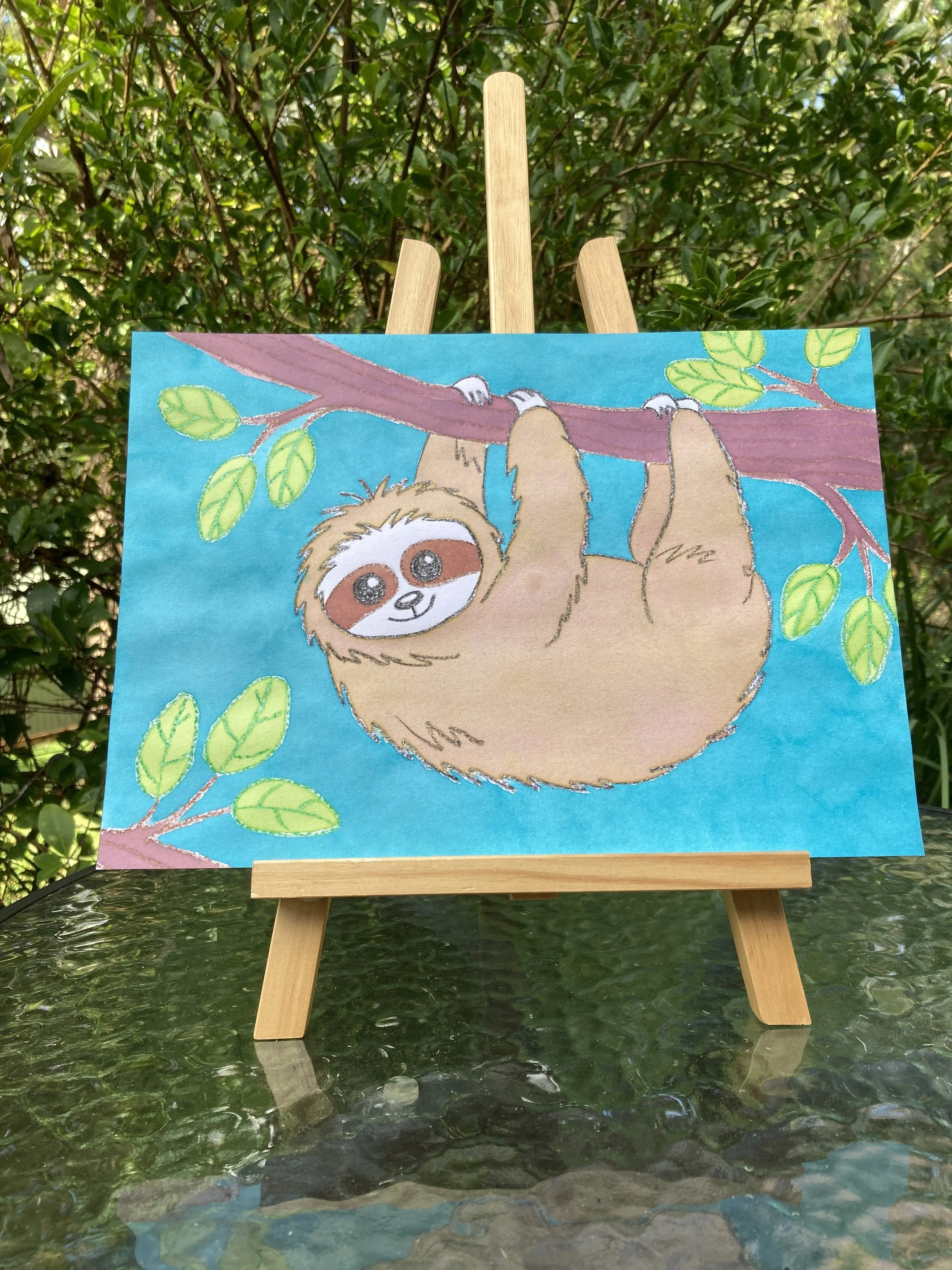 Friendly Sloth liquid watercolour painting on easel.JPG
