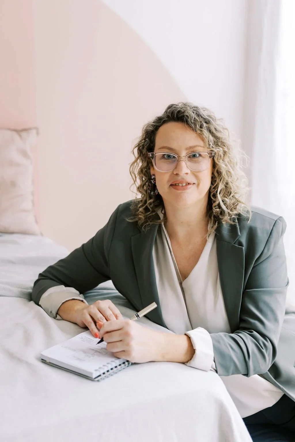 Kristine Posthumus sitting at desk ready to take notes