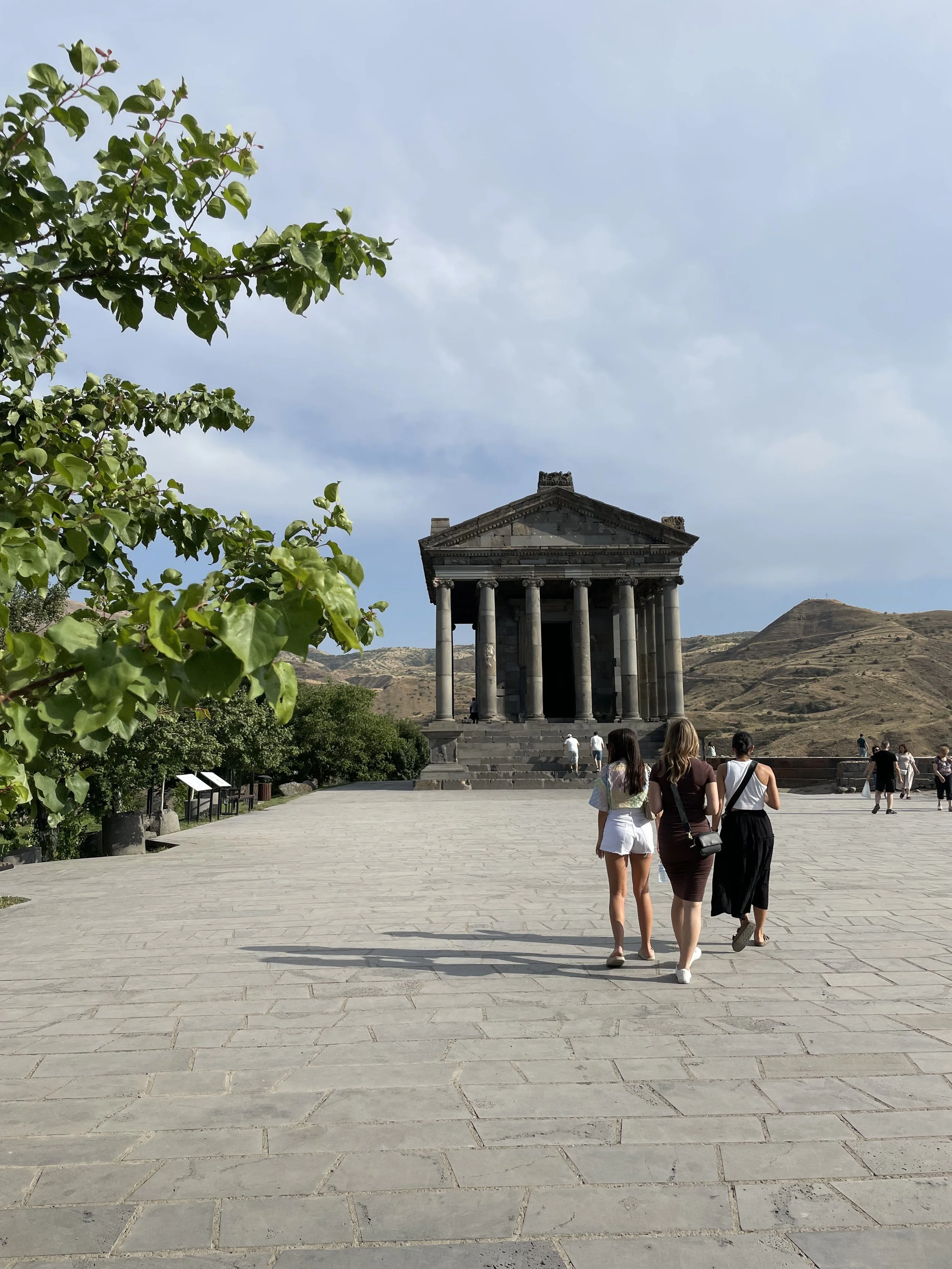 Women walking at Garni Temple, Armenia