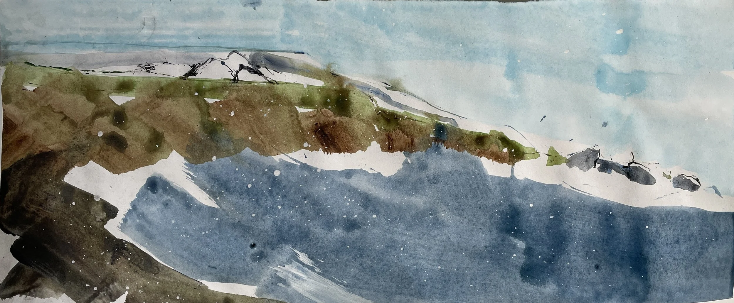 Watercolor painting of a rocky coast with snow-capped mountains in the background and a partly cloudy sky.