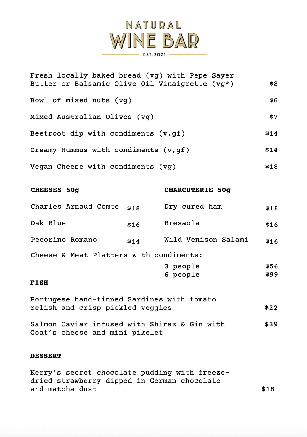 Natural Wine Shop & Bar: Menu from a natural wine bar, listing various dishes including bread, nuts, Greek olives, beetroot dip, hummus, vegan cheese, cheeses, charcuterie, fish, and dessert, with prices.