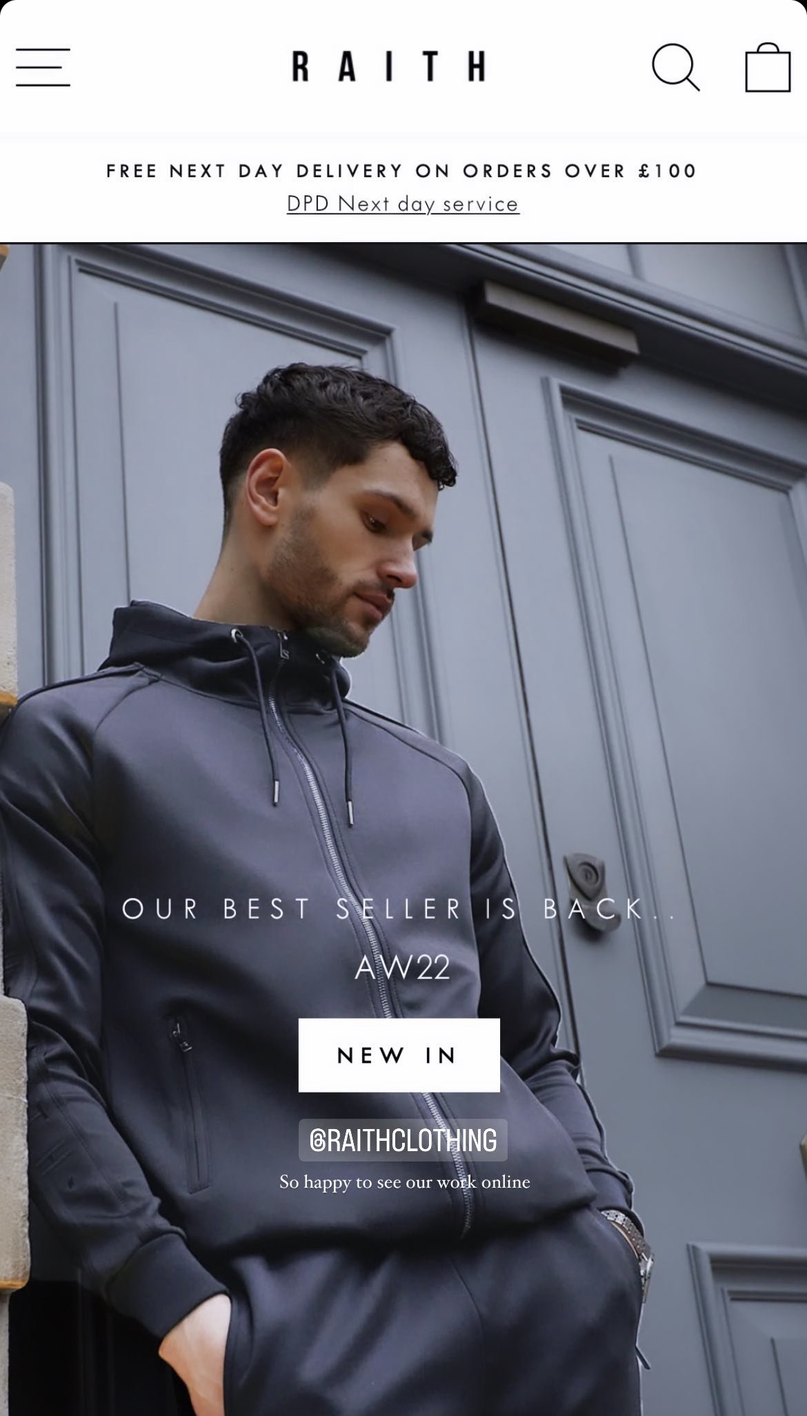 Young man in a black hooded leather jacket standing outdoors against a gray door, looking down with hands in pockets, promotional text overlay for RAITh clothing brand, announcing new autumn/winter 2022 collection and online availability.