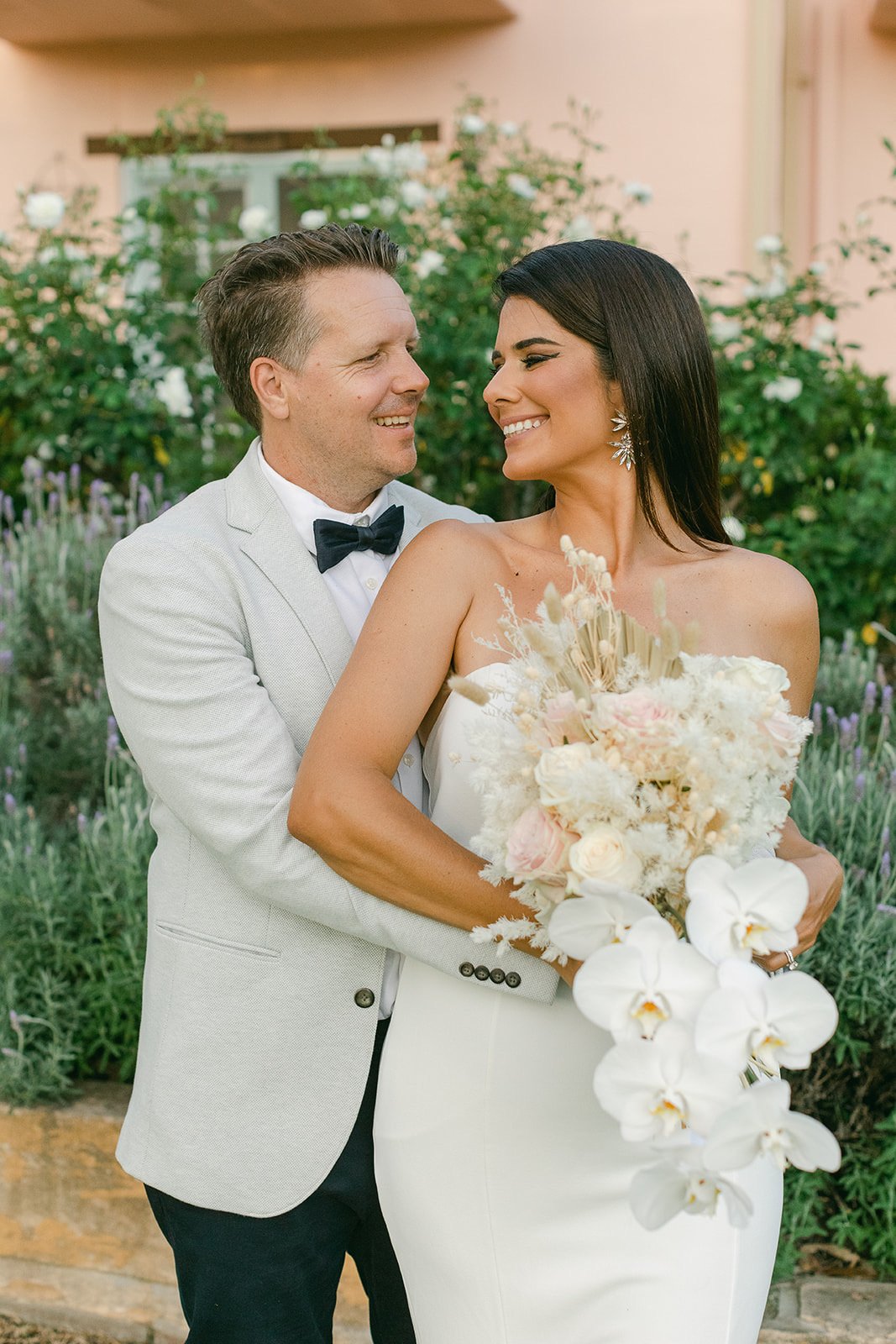  romantic wedding photography couple looking at each other holding bouquet By Raquel Pires Photography the best wedding photographer Sydney australia  