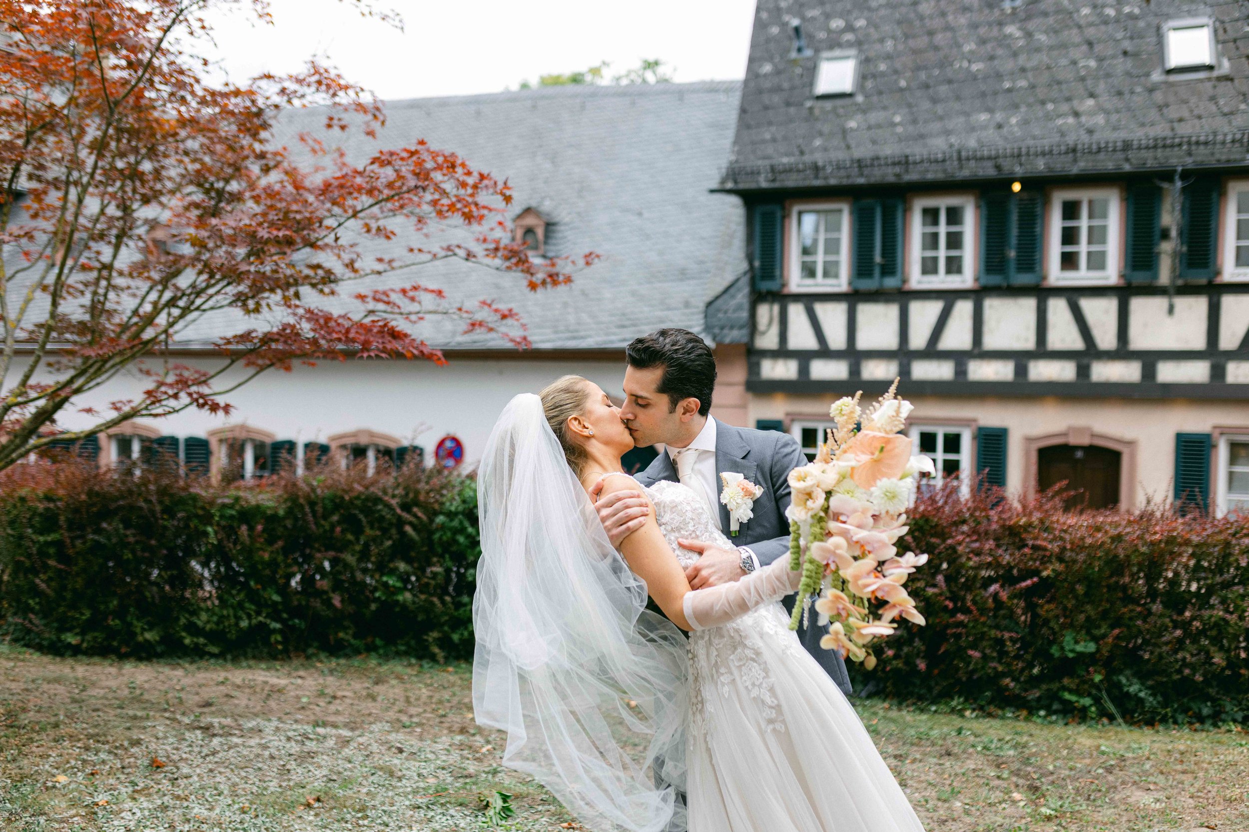 a wedding in Frankfurt Germany the bride and groom photoshoot after the ceremony in fronto of the church 
