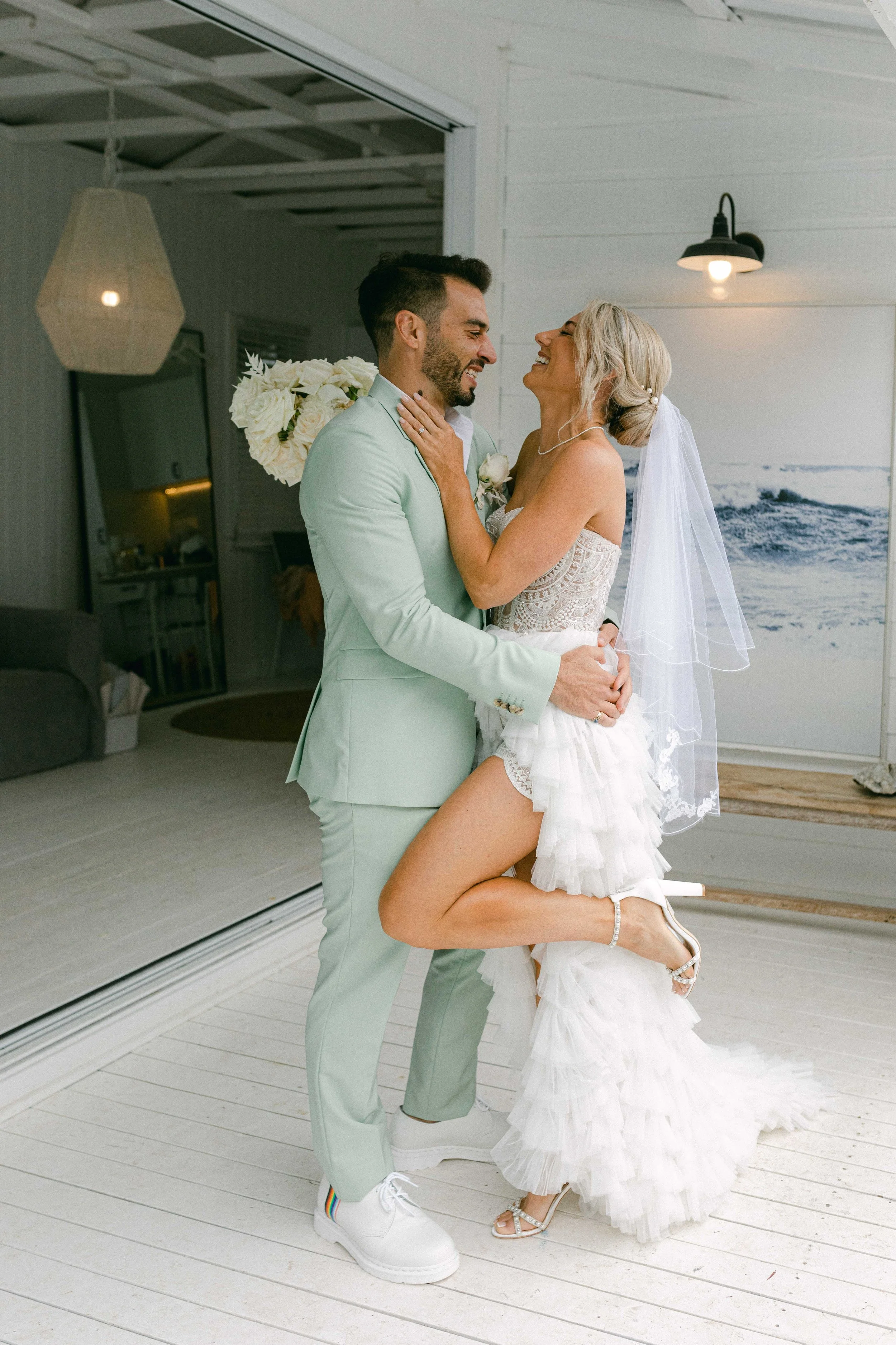 candid photo of a couple laughing together at the cove wedding venue