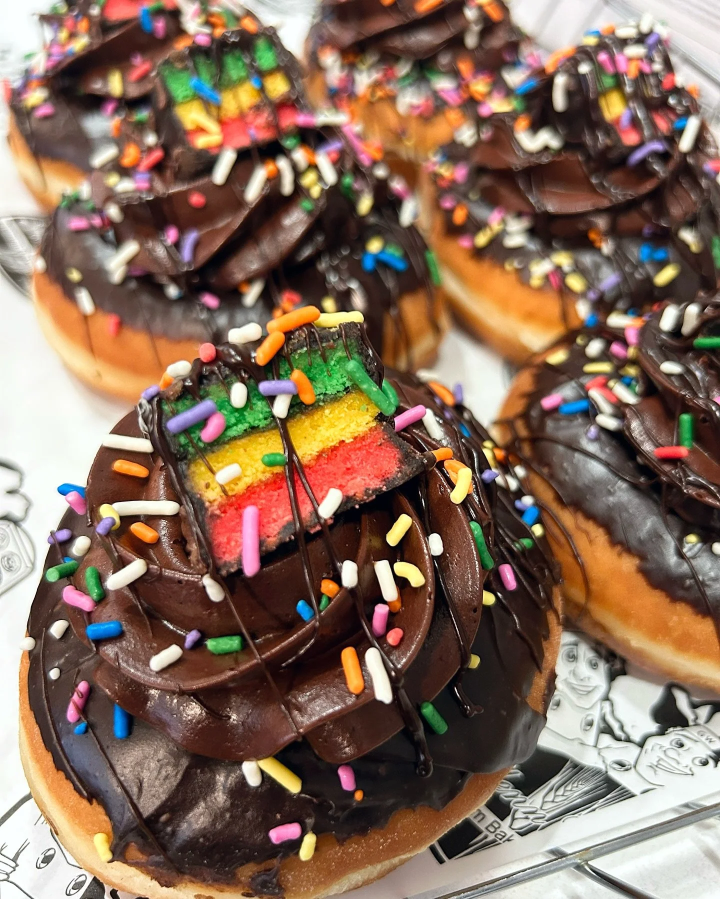 🎉🍩✨ One day only this Thursday. Try our Rainbow Cookie Over the Top Donut exclusively in-store while supplies last. Get yours before they&rsquo;re gone. #LongIsland #RainbowCookieDonut