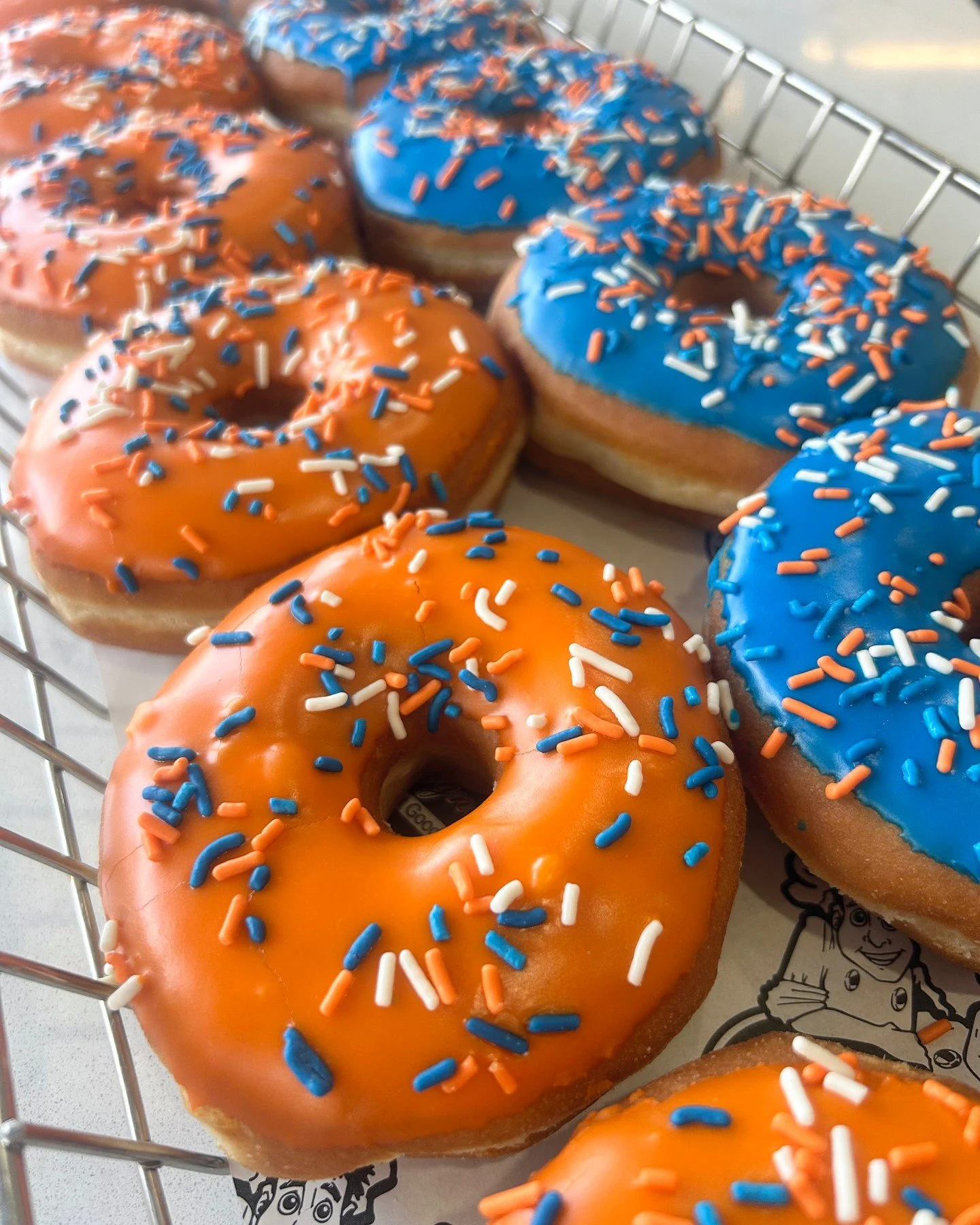 🏒🍩🔵🟠 Let&rsquo;s go Islanders! Celebrate game days with our New York Islanders themed donuts, now available at Glenn Wayne Bakery. #Bakery #Bohemia #Donuts #GlennWayneBakery #LongIsland