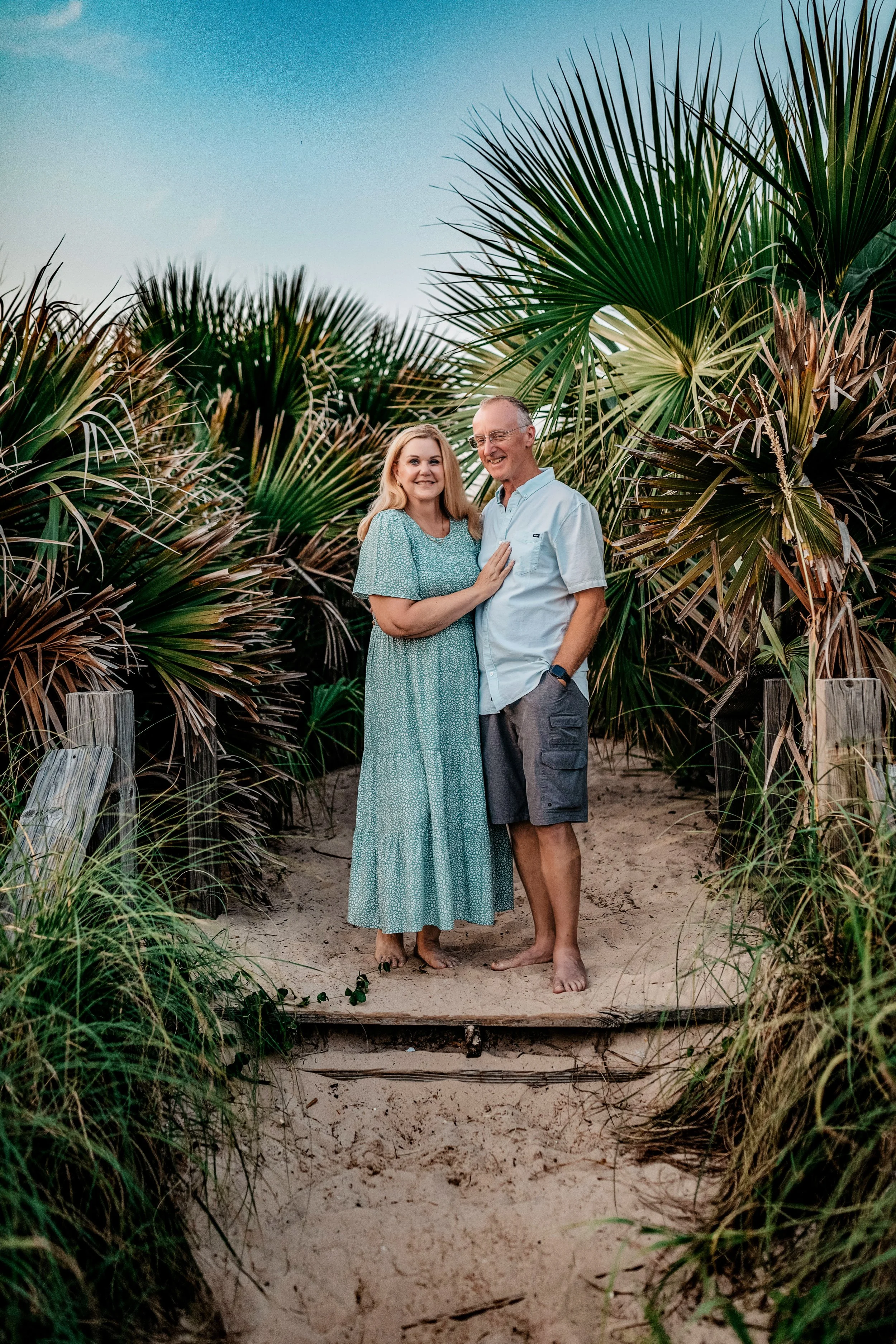 Grandparents on the sandy dune path during an Inlet Beach family photography session on 30A