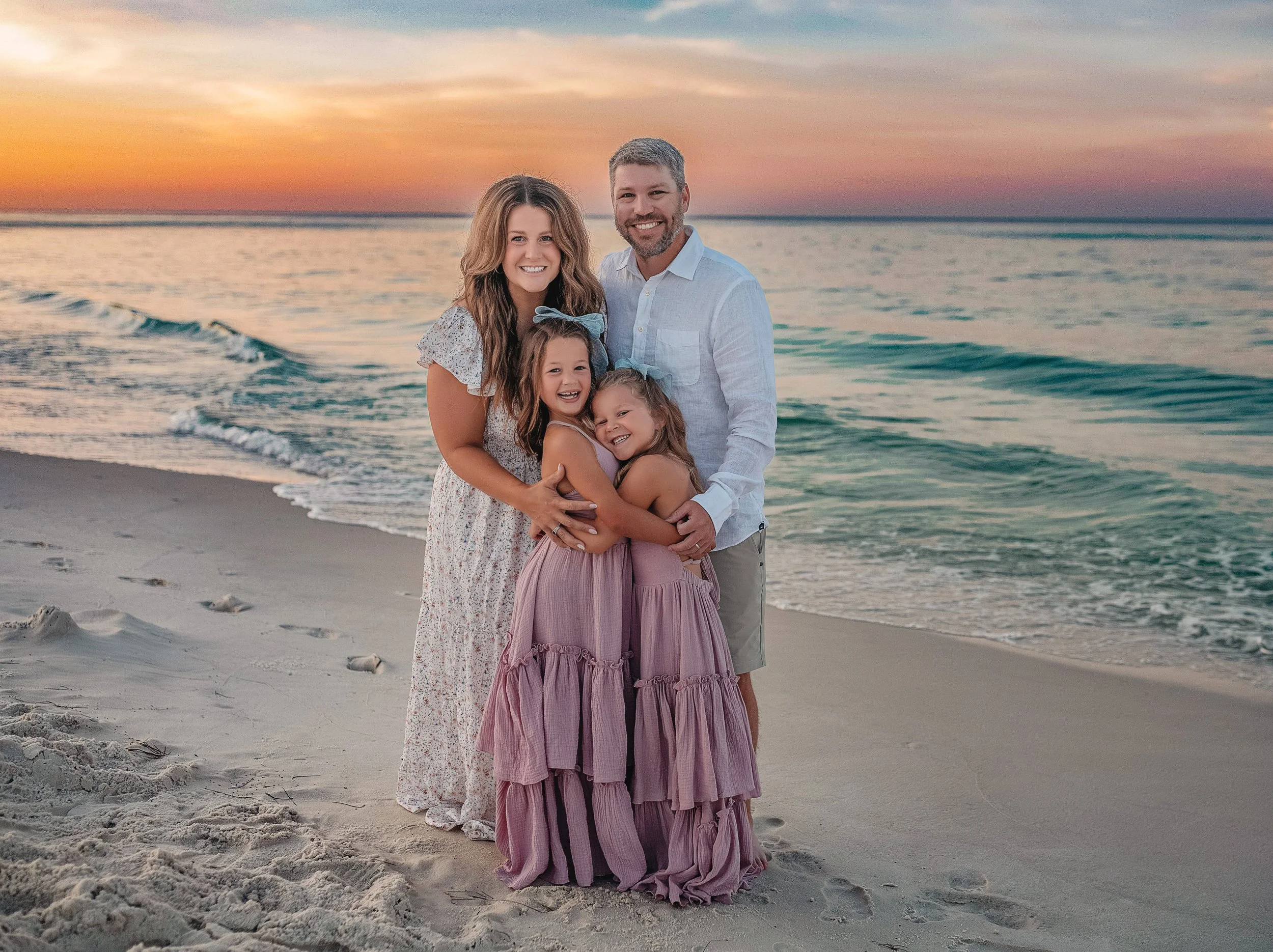 Sunrise family photos in Destin Florida with two young daughters