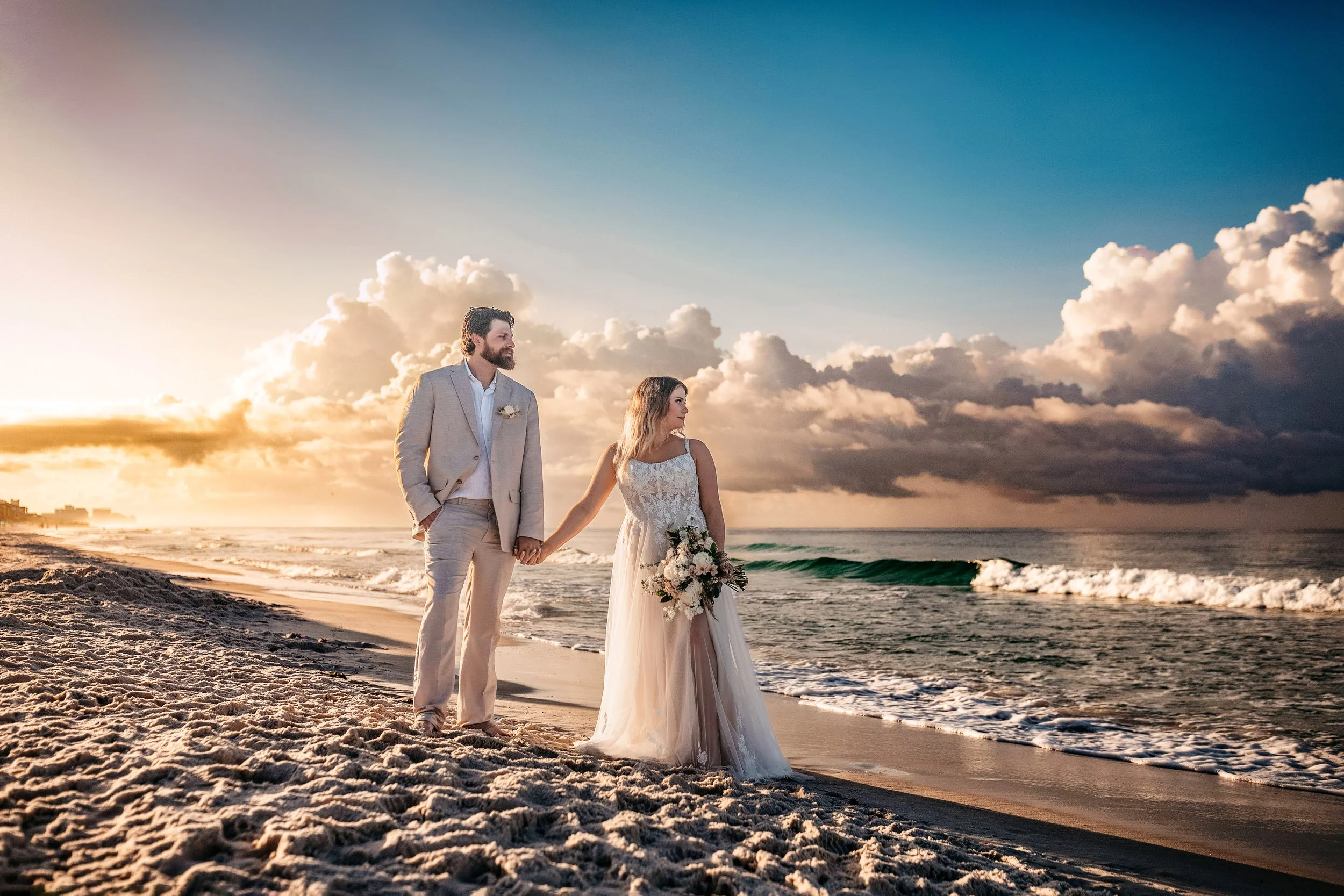 Romantic sunset bridal portraits on 30A with dramatic clouds and coastal light captured in a timeless, editorial style for couples eloping or celebrating milestone weddings along Seaside, Alys Beach, and Rosemary Beach.
