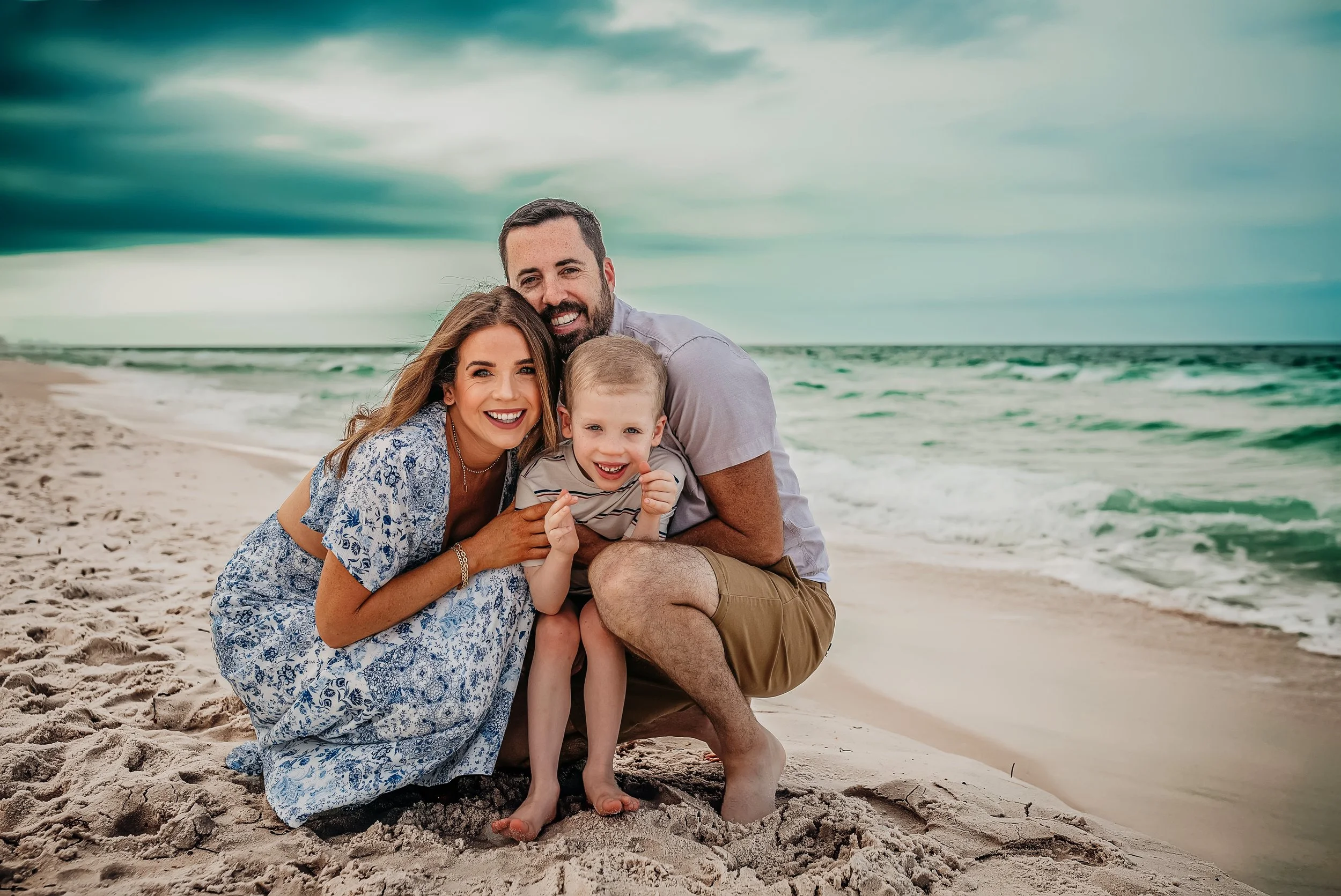 A family laughing together on the Emerald Coast, captured by a Panama City Beach photographer specializing in luxury lifestyle.