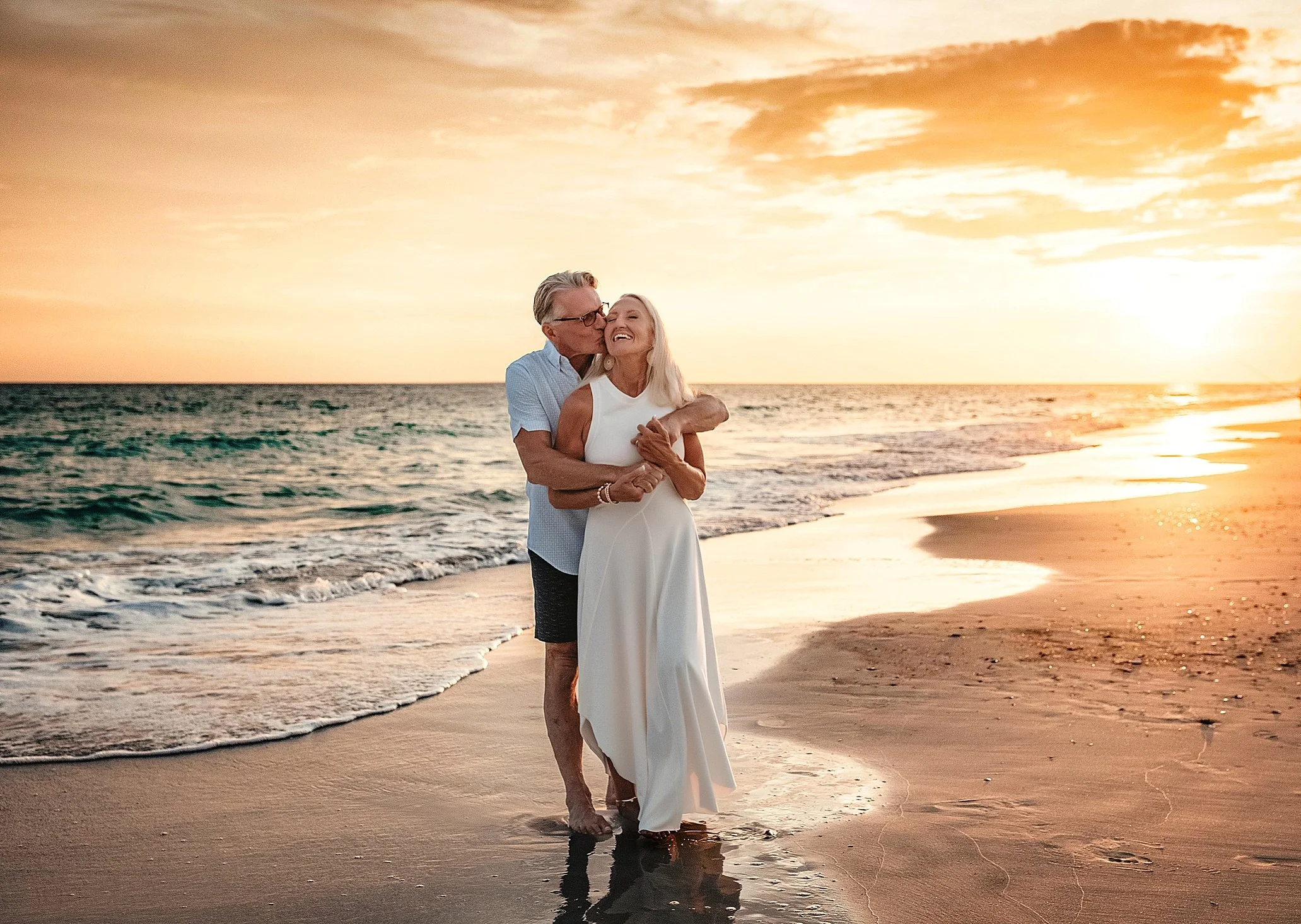 Anniversary couple session on 30A at sunset with intimate posing, cinematic skies, and warm coastal movement. Frequently booked for vow renewals and milestone celebrations in Rosemary Beach and Alys Beach.
