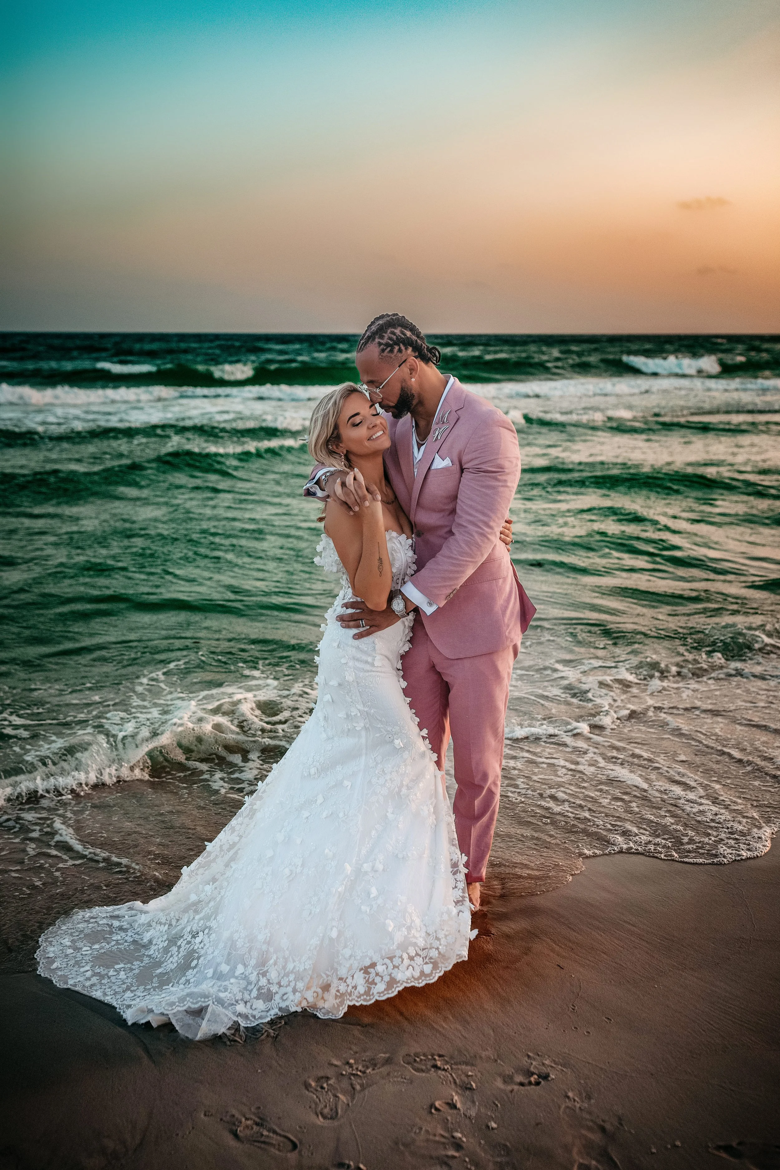 a bride and groom embracing during their wedding in Destin, Fl