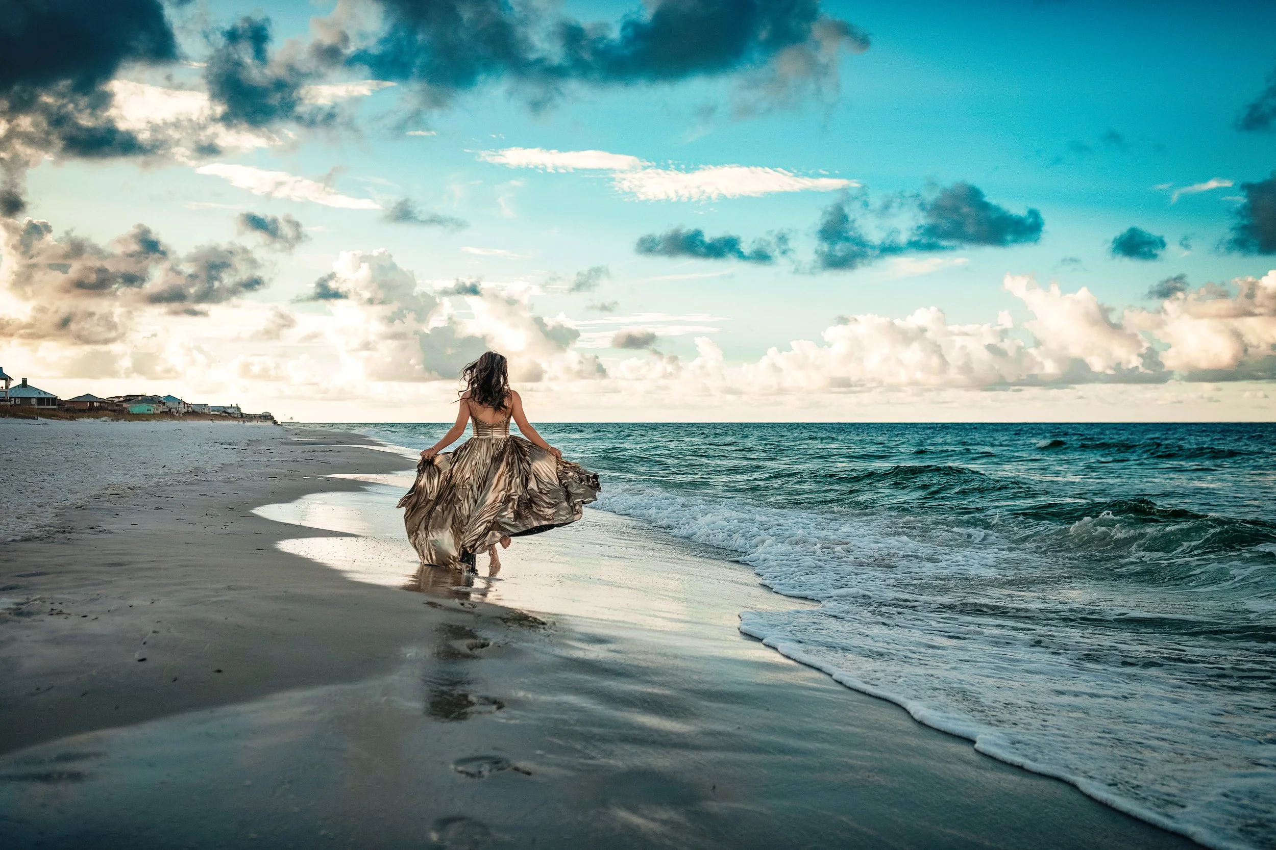 A  senior portrait sessions at sunrise on 30A featuring sunset lighting and various beach backdrops from Blue Mountain to Alys Beach.