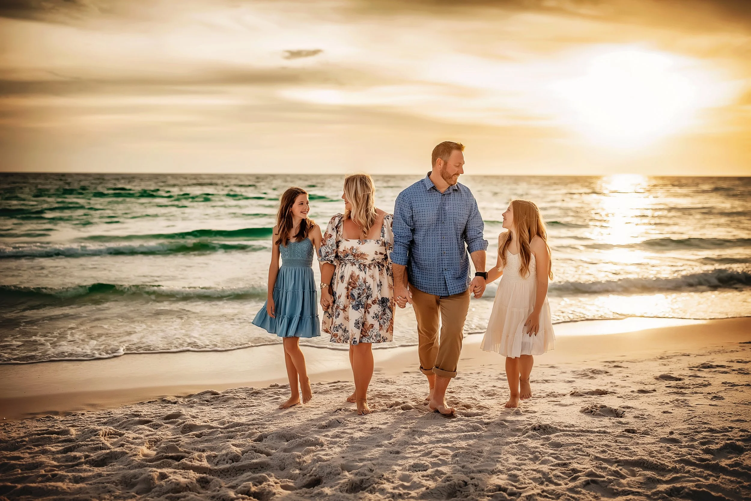 Family portraits at sunset on 30A with barefoot styling, coastal movement, and warm editorial color. Booked for vacation sessions and milestone trips in Rosemary Beach and WaterSound.
