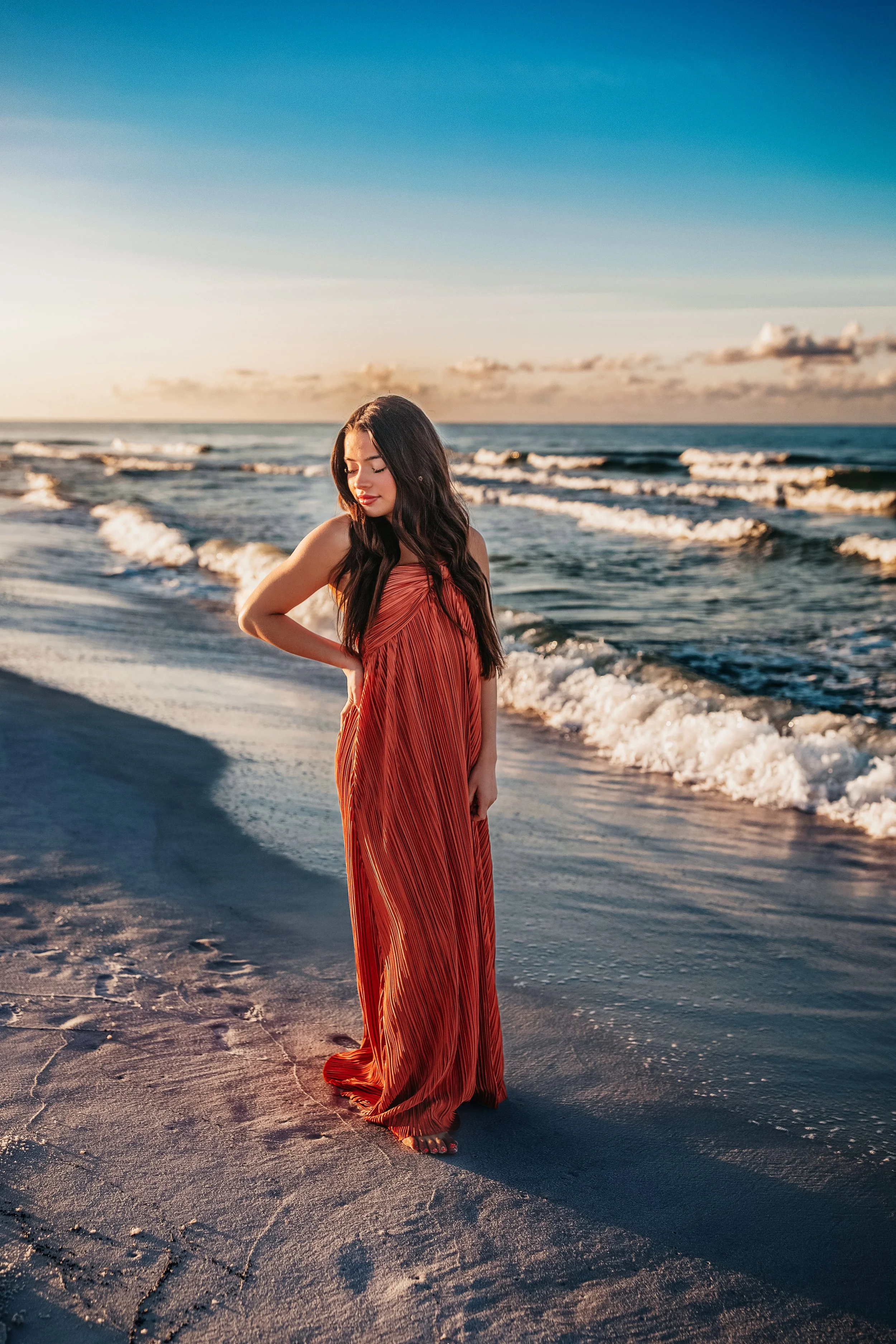 A high school senior girl  portrait sessions on 30A featuring sunset lighting and various beach backdrops from Blue Mountain to Alys Beach.