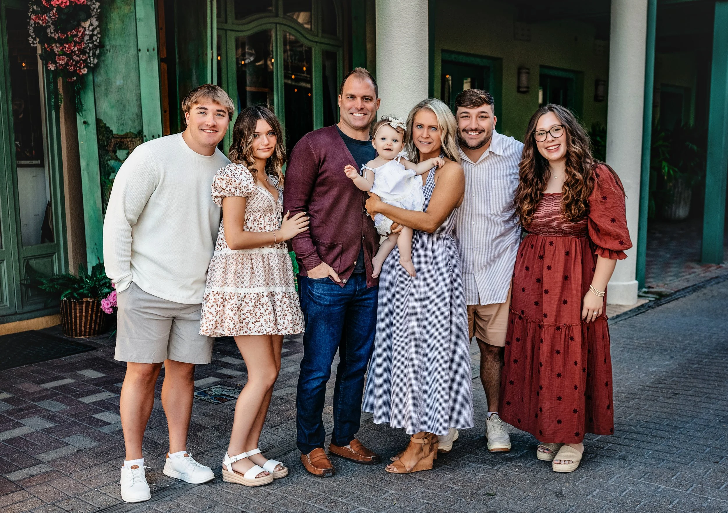 Luxury family portrait session on 30A featuring a multigenerational group of eight, styled in neutral summer wardrobe for elevated, heirloom-style vacation photos perfect for extended family on WaterColor or Seagrove Beach.