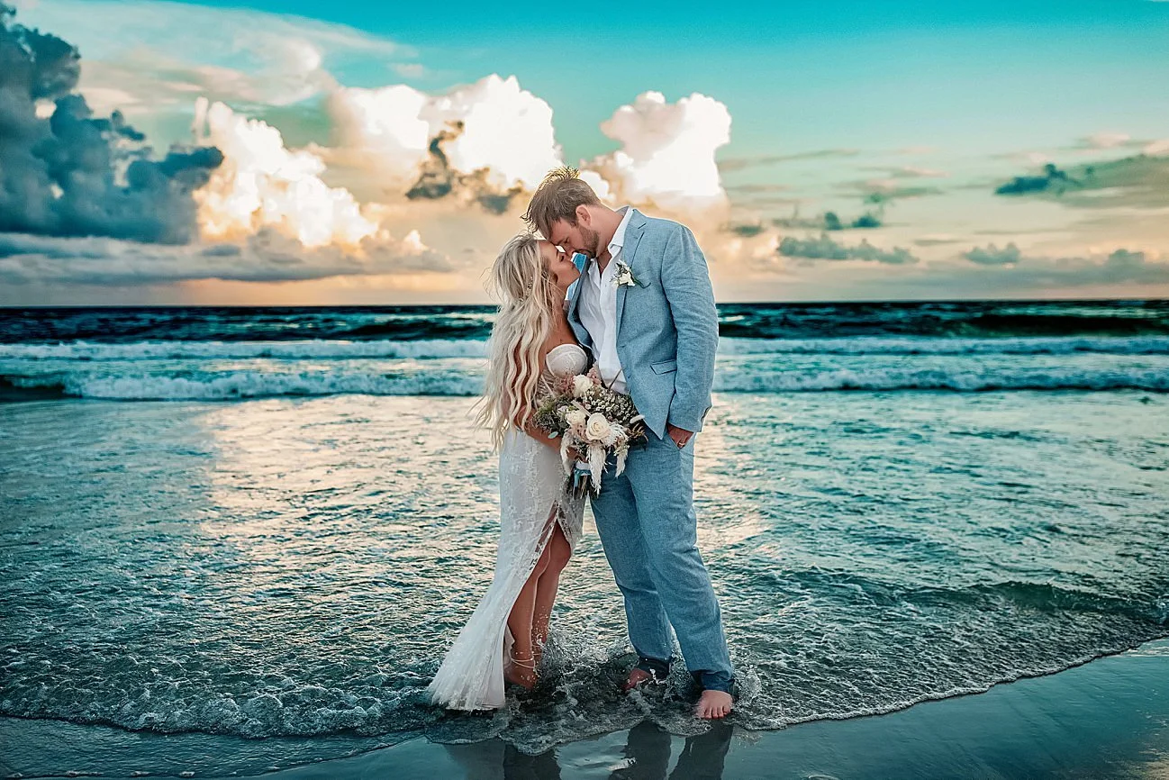 a wedding couple taking a moment to celebrate their wedding in Rosemary Beach 