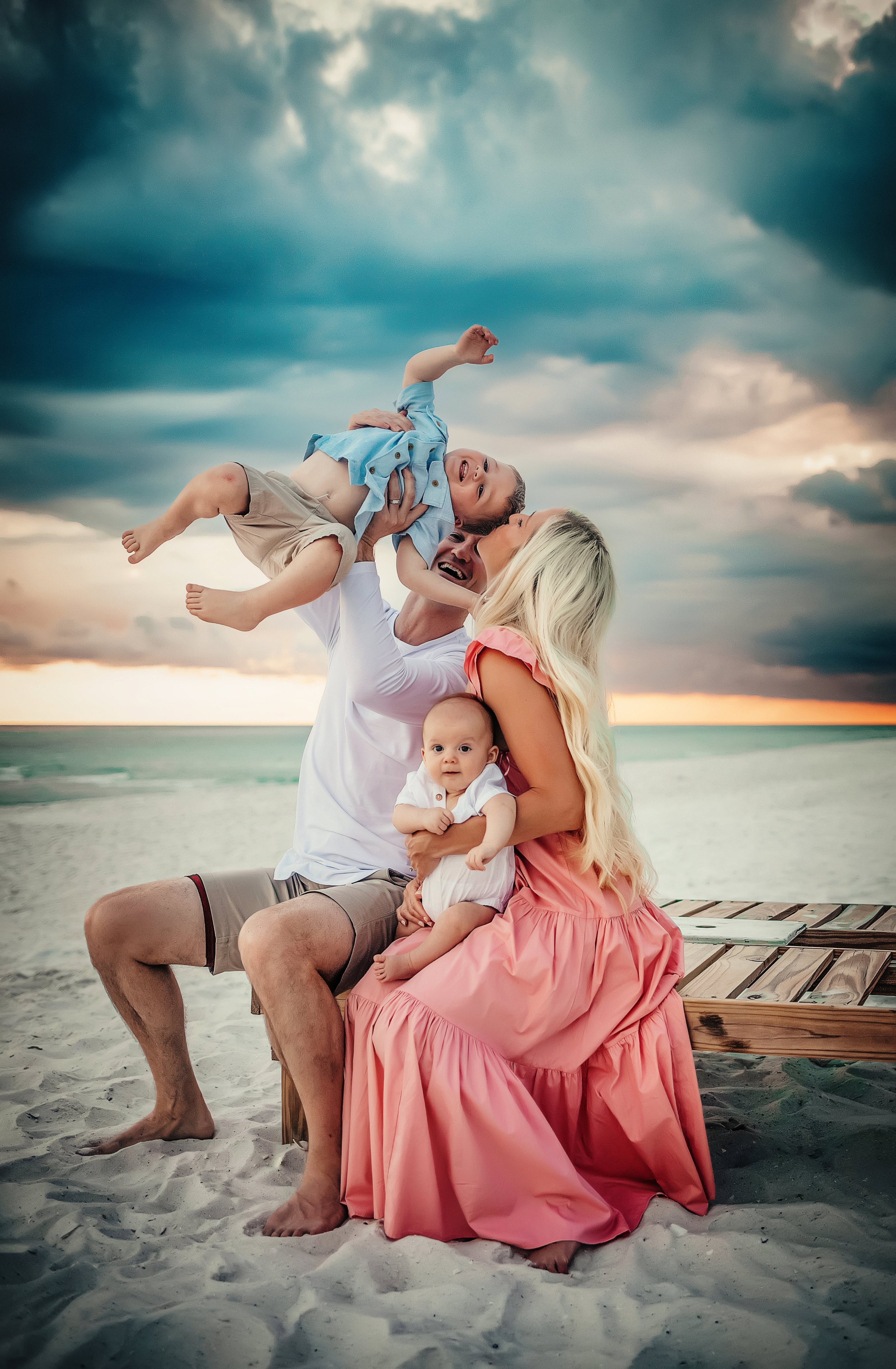 Joyful family of four during a sunset beach photography session on 30A, photographed by a trusted Santa Rosa Beach family photographer specializing in relaxed, natural family portraits.