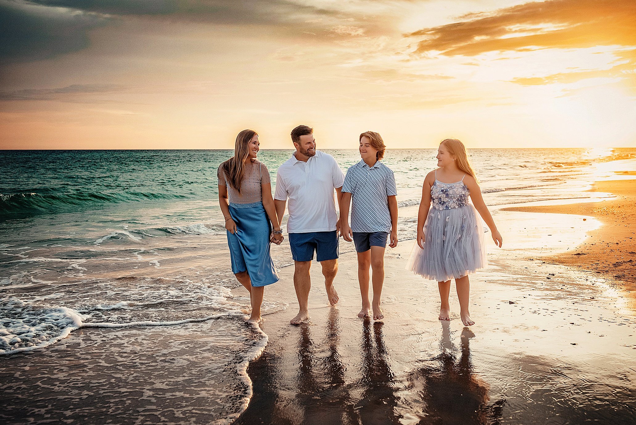 Sunset family portraits on 30A with barefoot movement, warm coastal color, and relaxed candid posing. Booked for vacation sessions and milestone trips in Seagrove and WaterColor.
