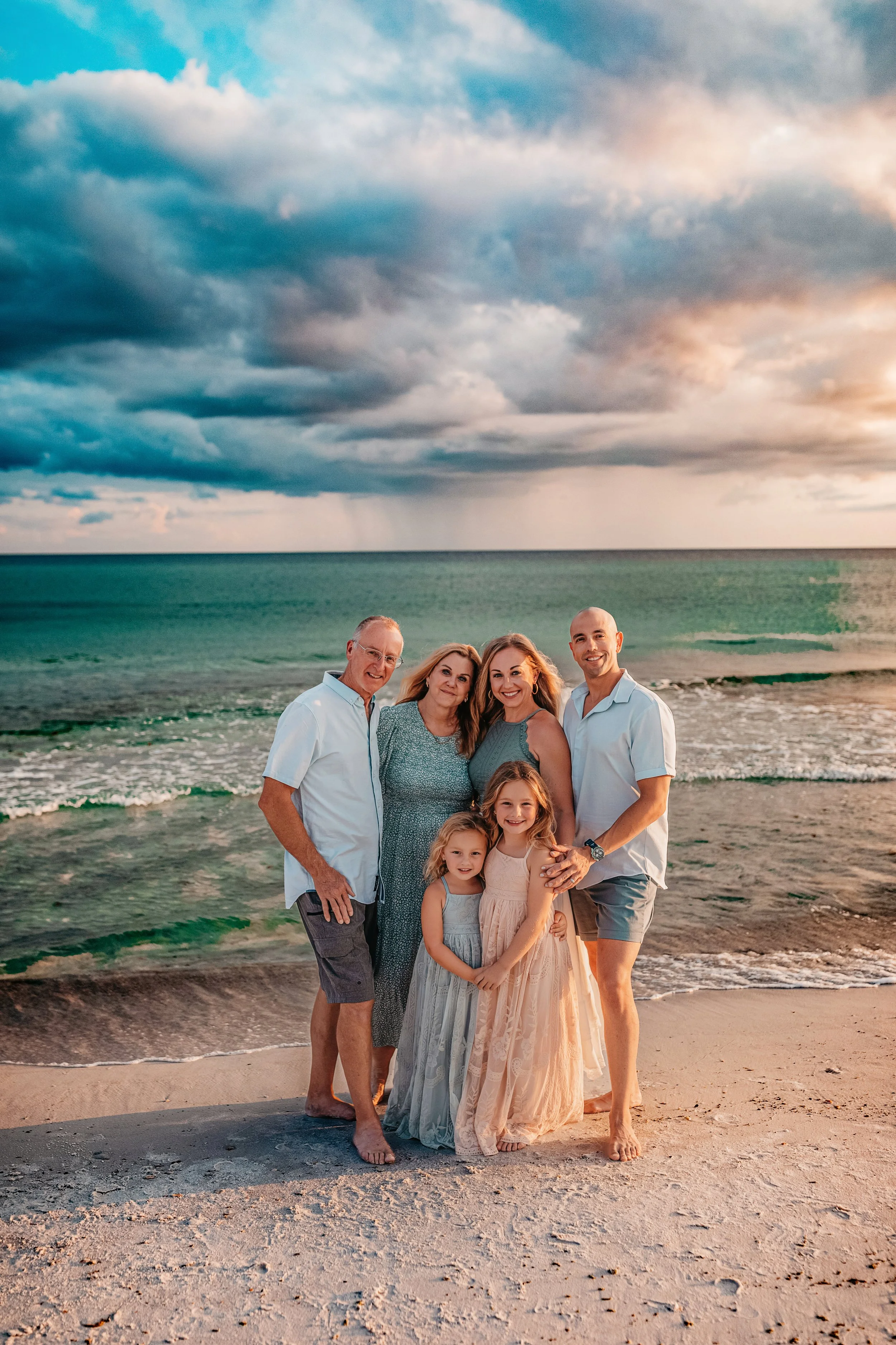 Grandparents portrait surrounded by coastal dunes during a 30A family beach photography session at Inlet Beach