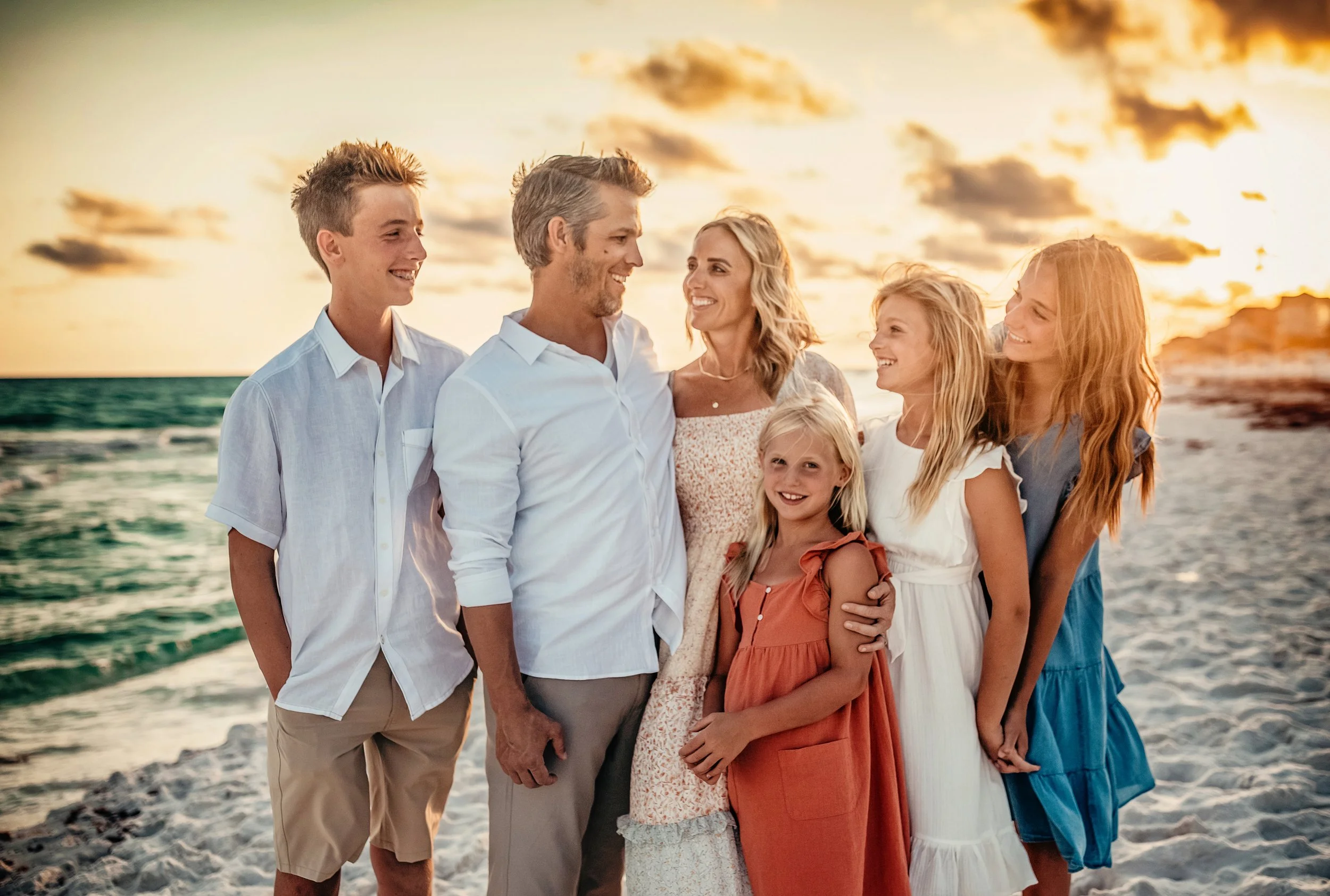 Family of five on Dune Allen Beach at golden hour — white linen shirts, terracotta dress, blue dress — 30A Destin family beach photographer