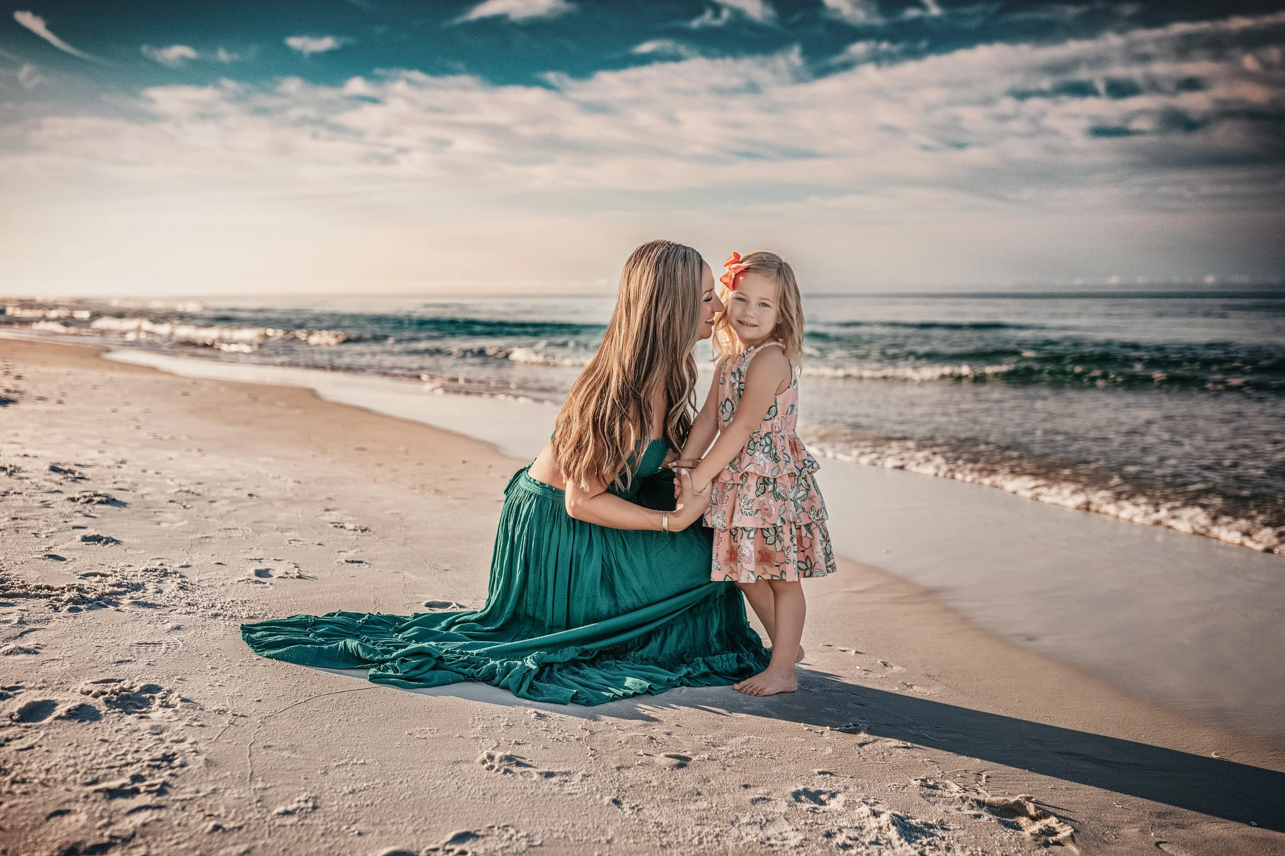 Mother and Daughter snuggled up during their 30A Family Beach Session on Seacrest beach