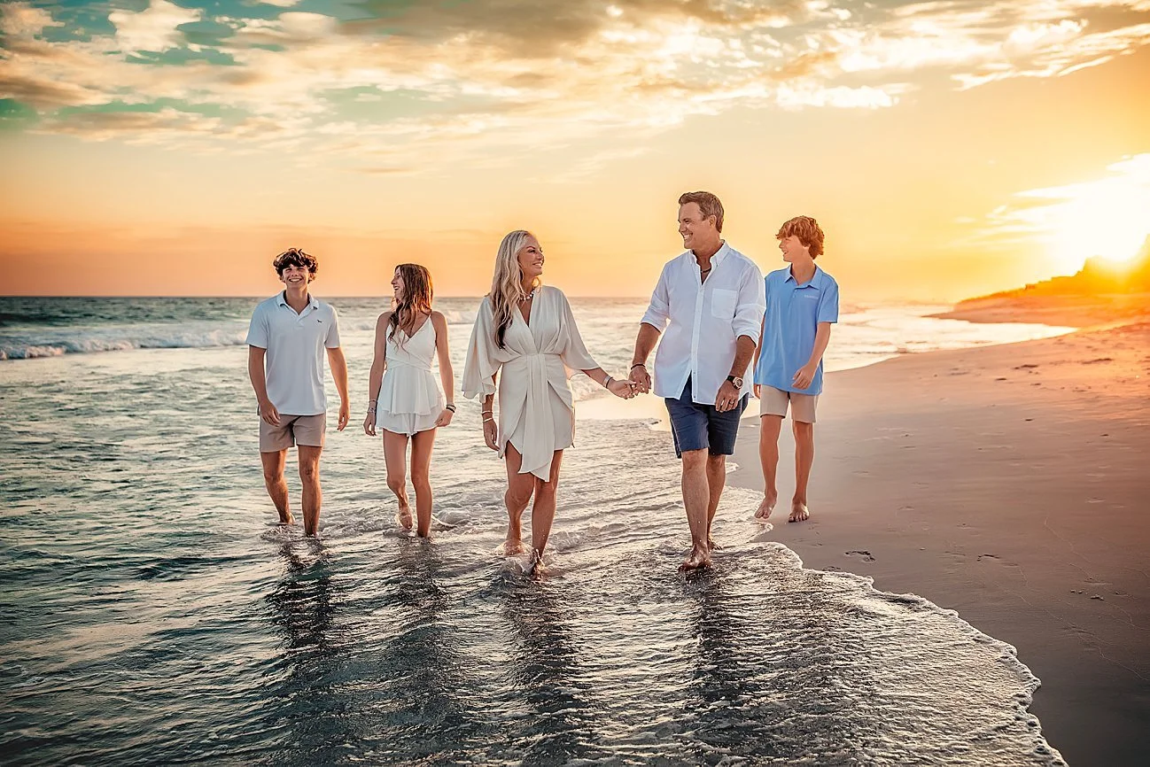Family of five walking on Rosemary Beach at golden hour sunset — all white and blue outfits — 30A family beach photographer