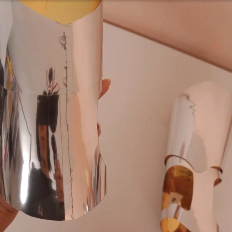 Sewn arm bands. You can see there is not a lot of overlap in the material to reduce bulk.