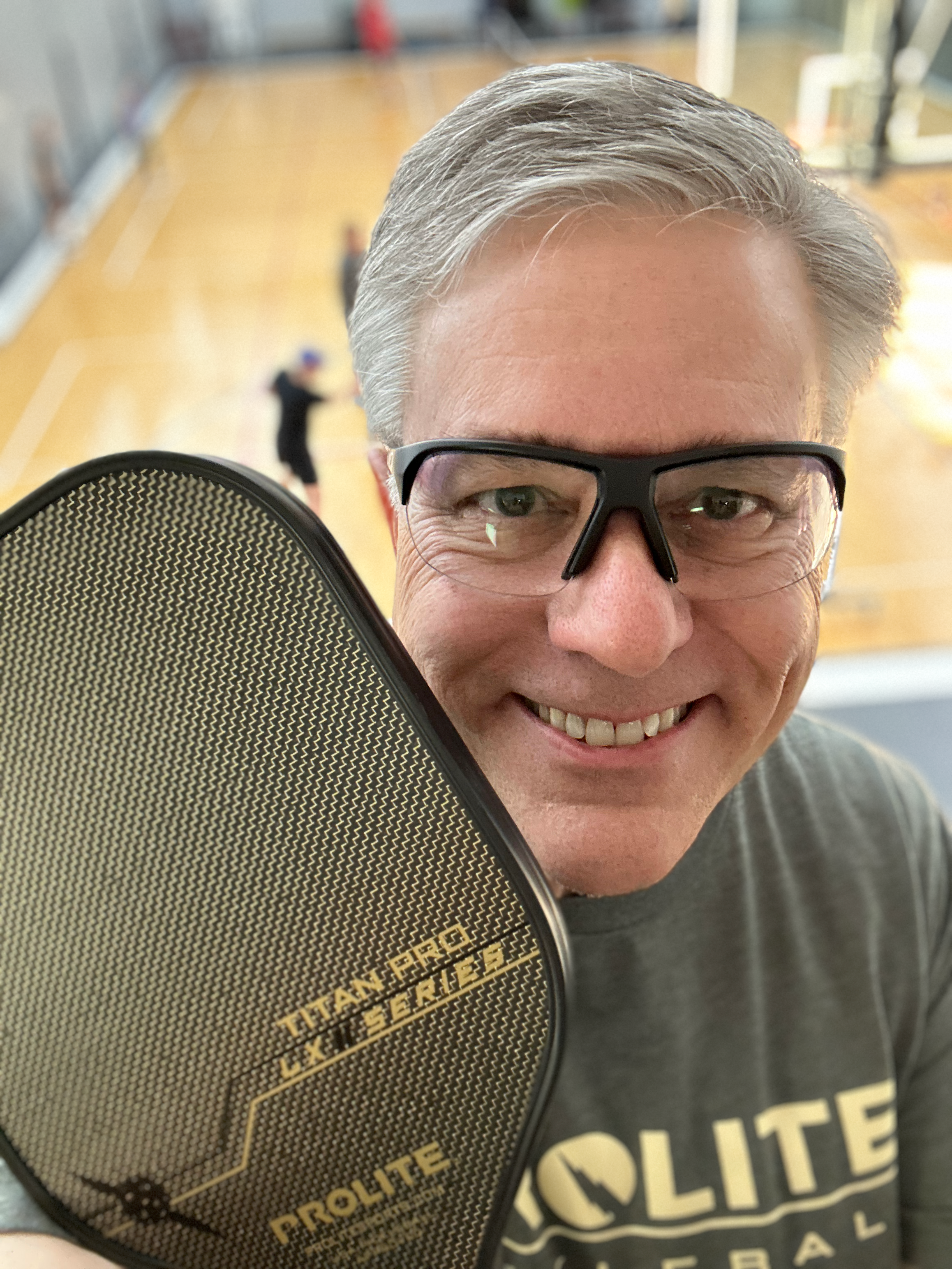Profile picture including PROLITE Titan Pro LX II paddle and RIA Eyewear prescription pickleball glasses