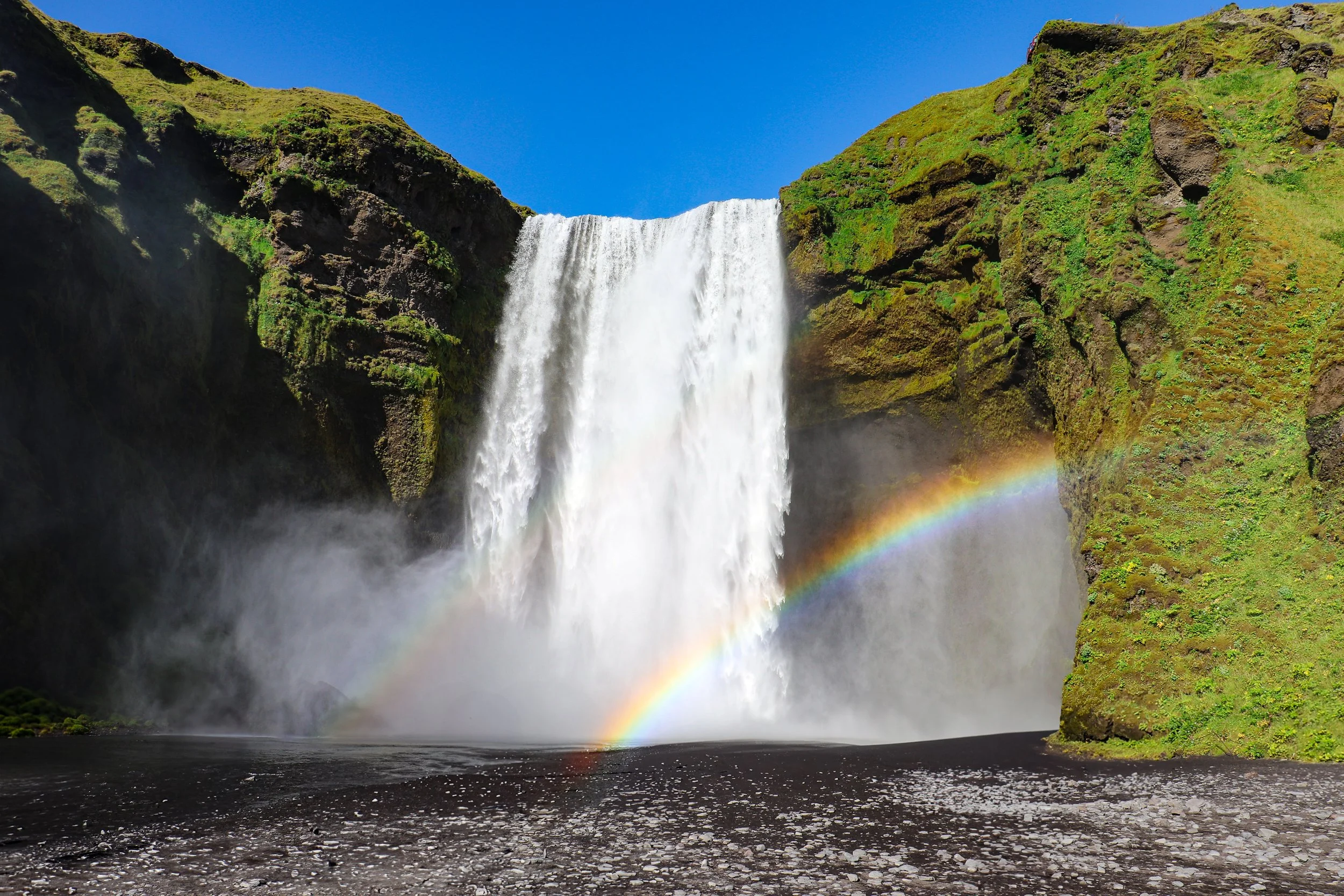 Skogafoss waterfall with rainbow on the Ring Road in Iceland