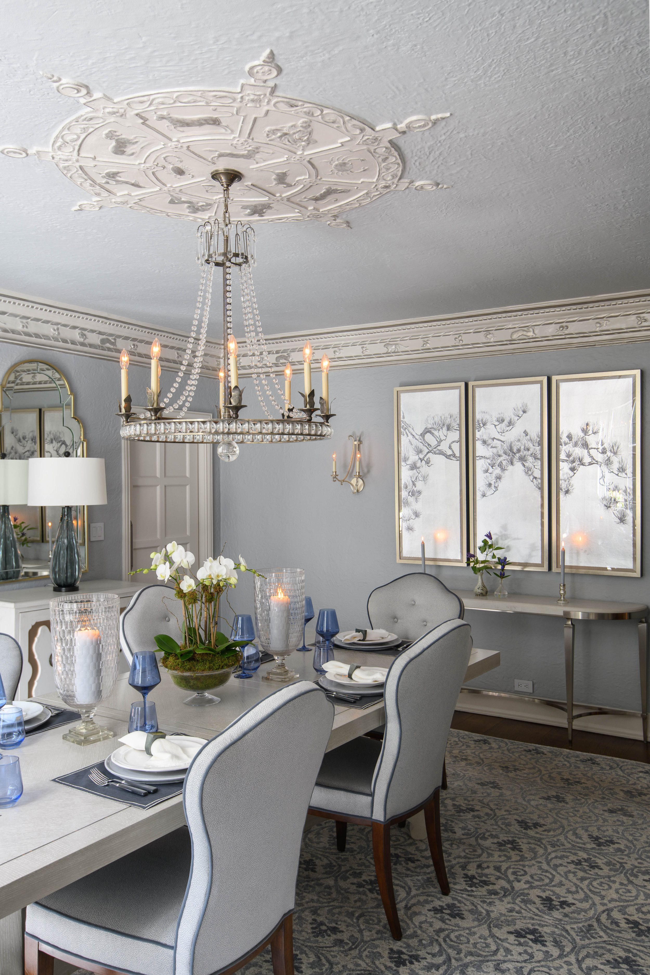 9-blue-accents-dining-area-white-candle-chandelier-chic-space-textured-rug-westechester-rinfret-interior-designs.jpg