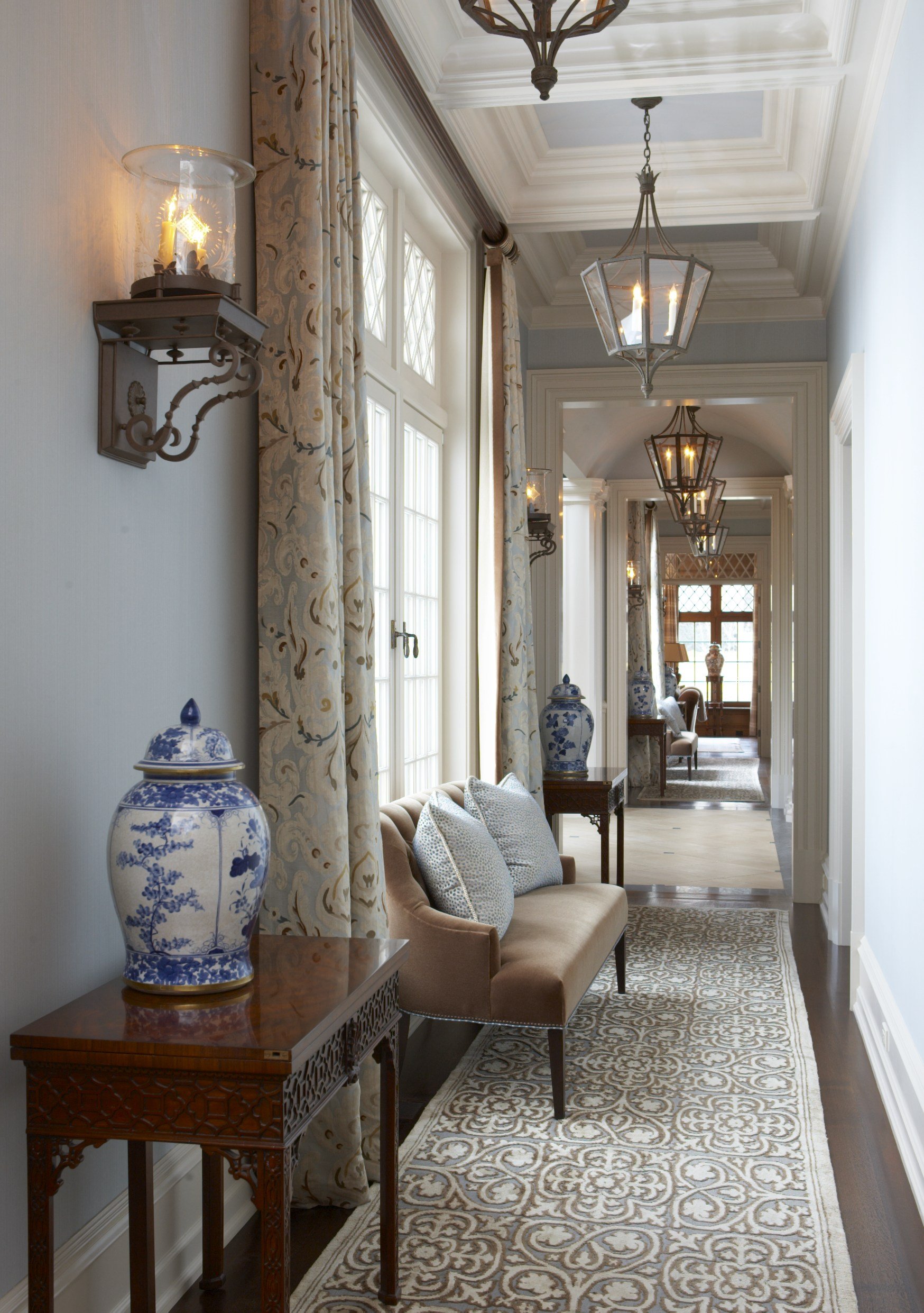 29-long-hallway-detailed-flooring-natural-light-rinfret-interior-designs.jpg