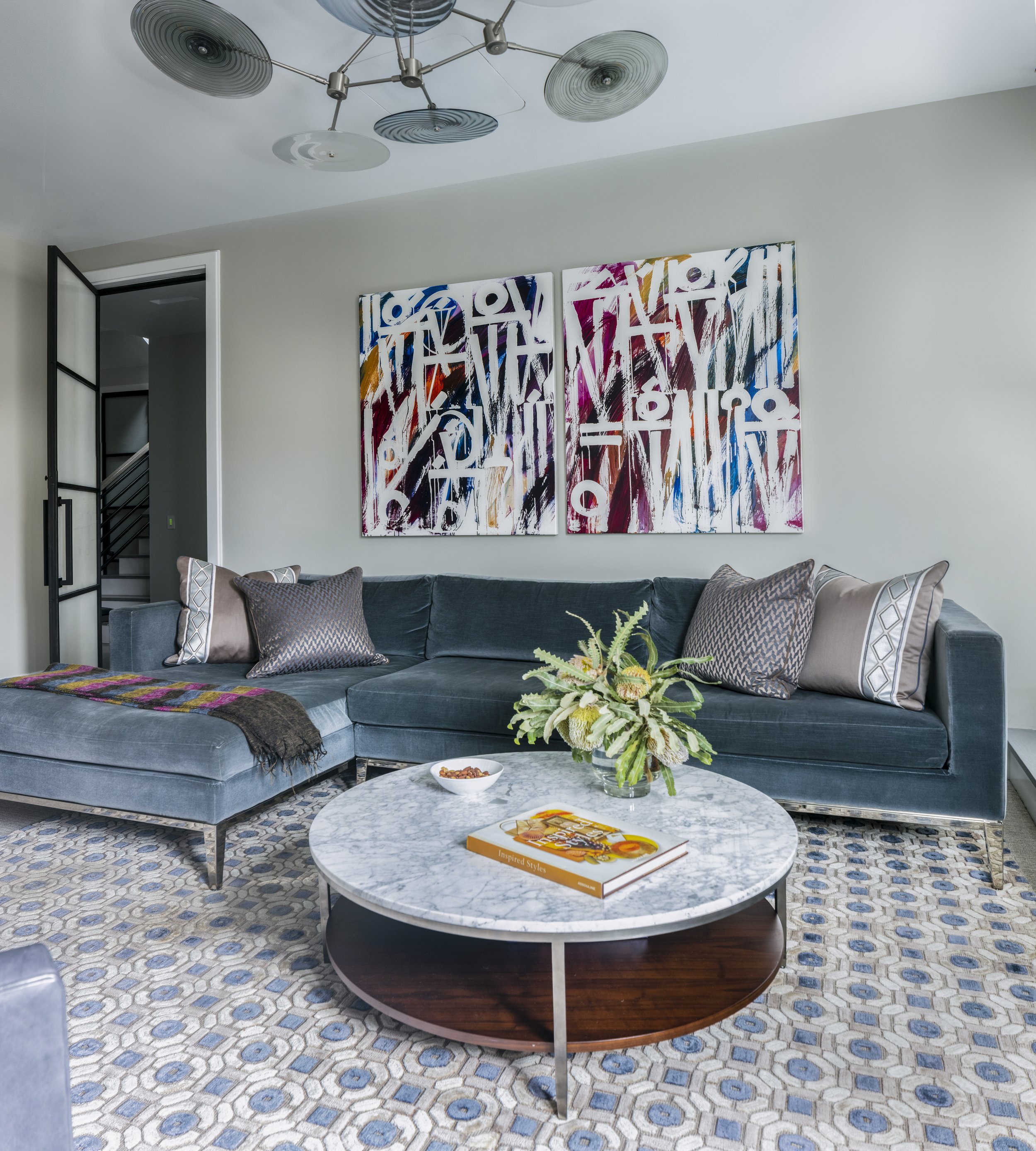 24-blue-tiled-rug-teal-velvet-couch-large-print-multiple-textured-designs-manhattan-penthouse-rinfret-interior-designs..jpg