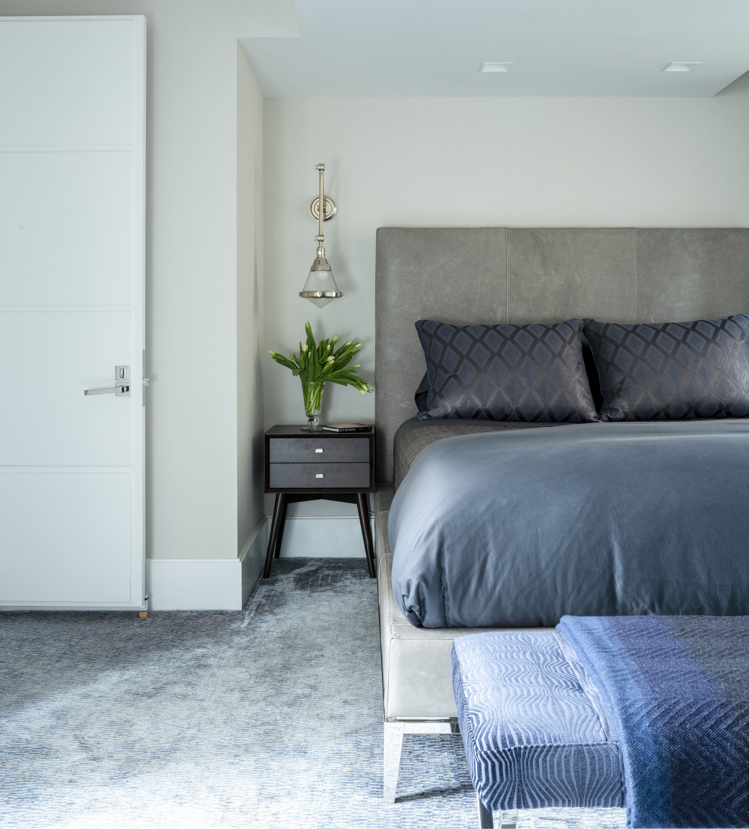 21-blue-rug-textured-throw-simple-bedroom-white-gray-accents-manhattan-penthouse-rinfret-interior-designs..jpg