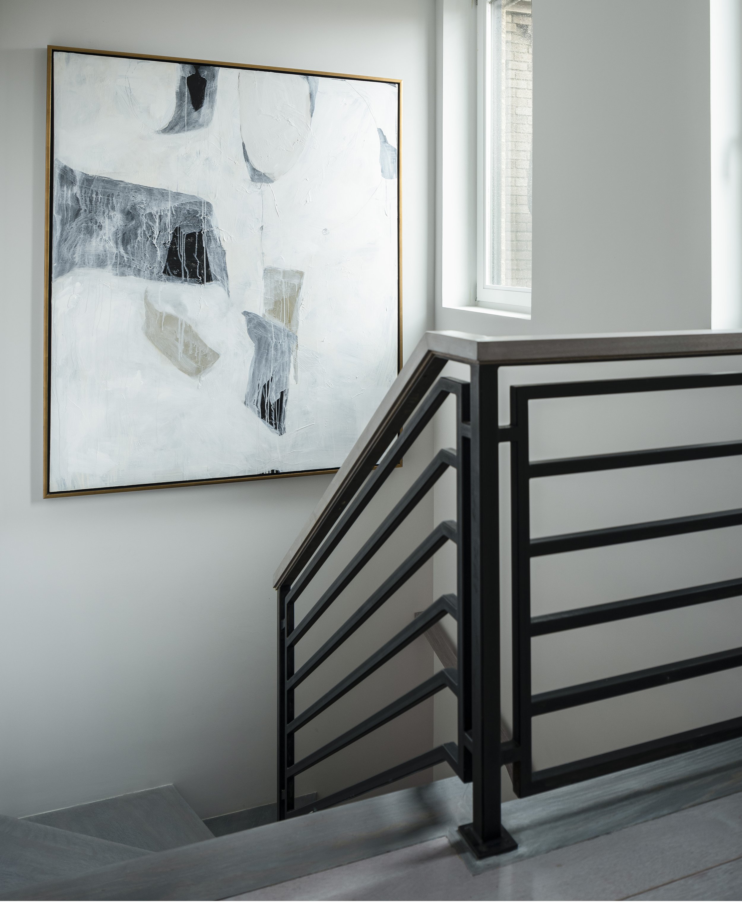 12-simple-modern-staircase-black-railing-large-white-gray-print-manhattan-penthouse-rinfret-interior-designs..jpg