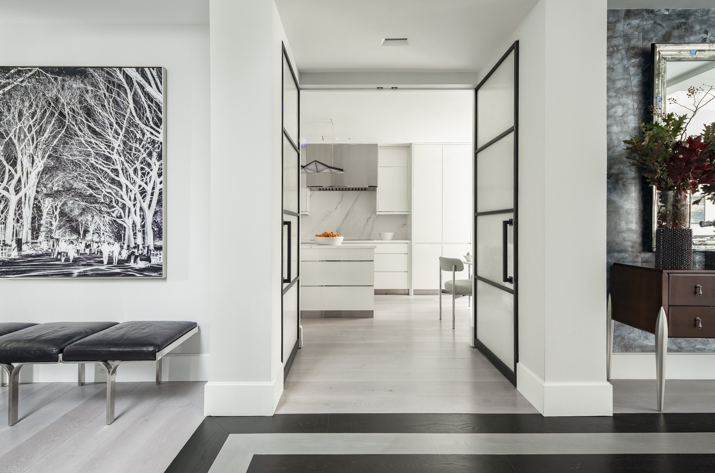 9-open-black-and-white-walkway-open-area-chic-manhattan-penthouse-rinfret-interior-designs.jpg