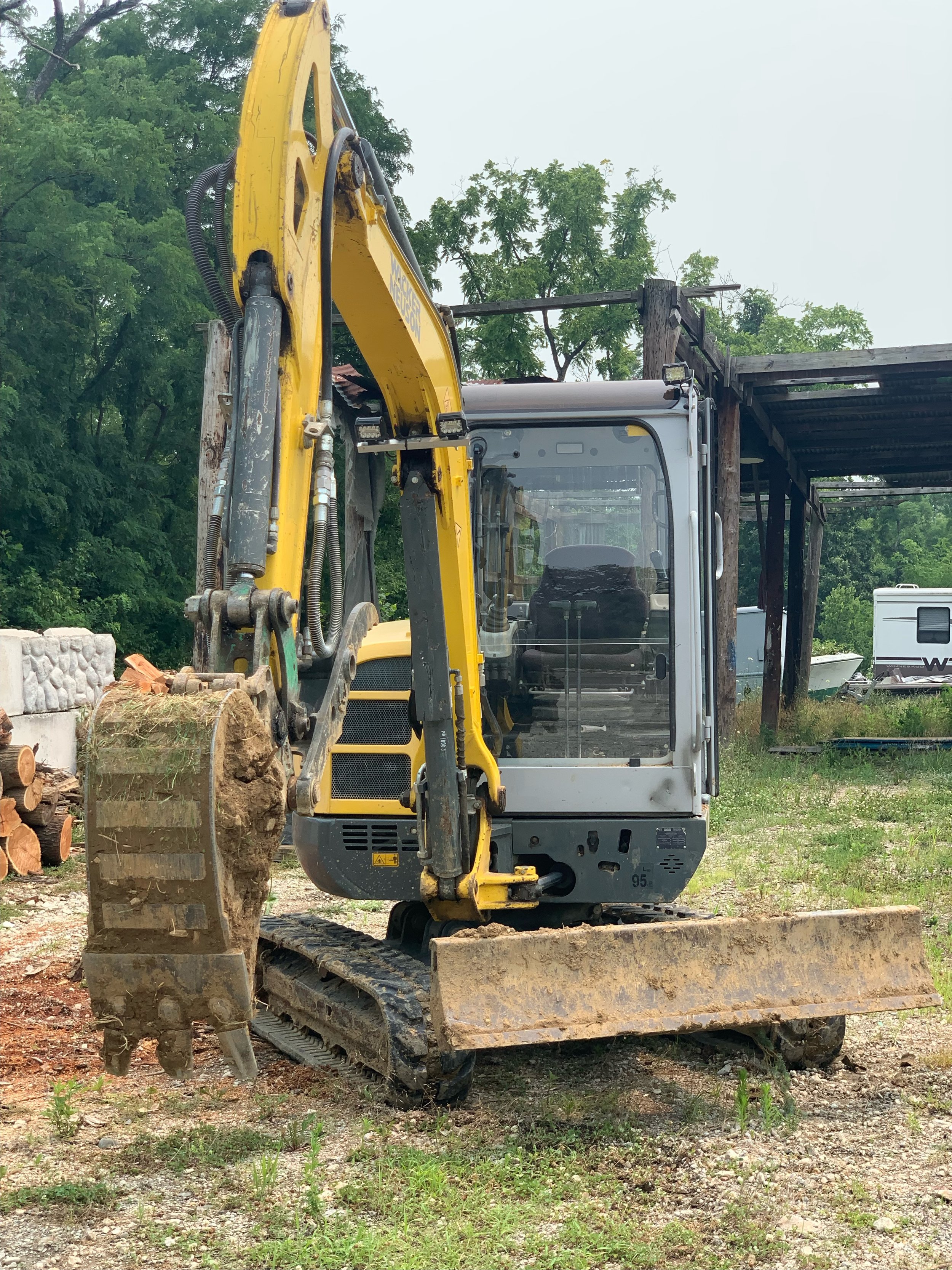 Excavator Detailing before photo in cincinnati, OH