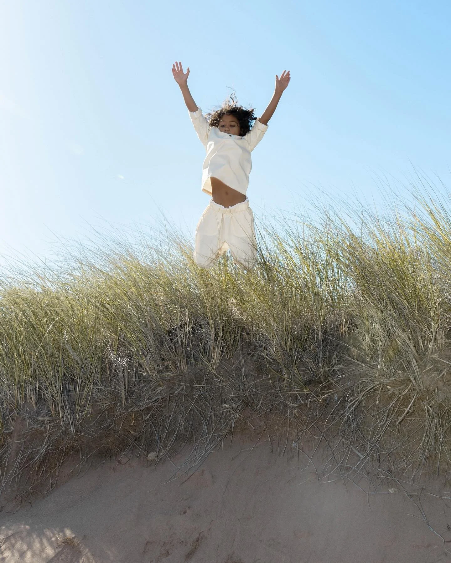 Kids at the beach. 

A mini series from a sweet elopement being delivered this week. When these kiddies arrived at their auntie&rsquo;s wedding, they instantly ran straight for jumping from these dunes. It was such a moment of that genuine childhood 
