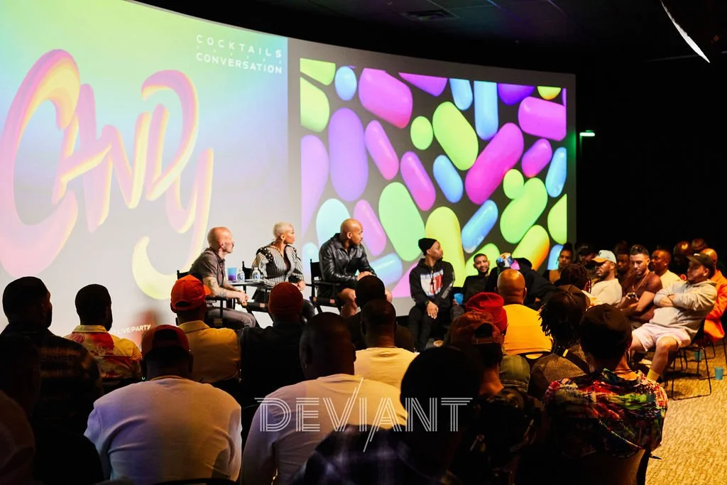 The panel at the Deviant Society Candy event. It shows a panel of five people, with a large audience listening in.
