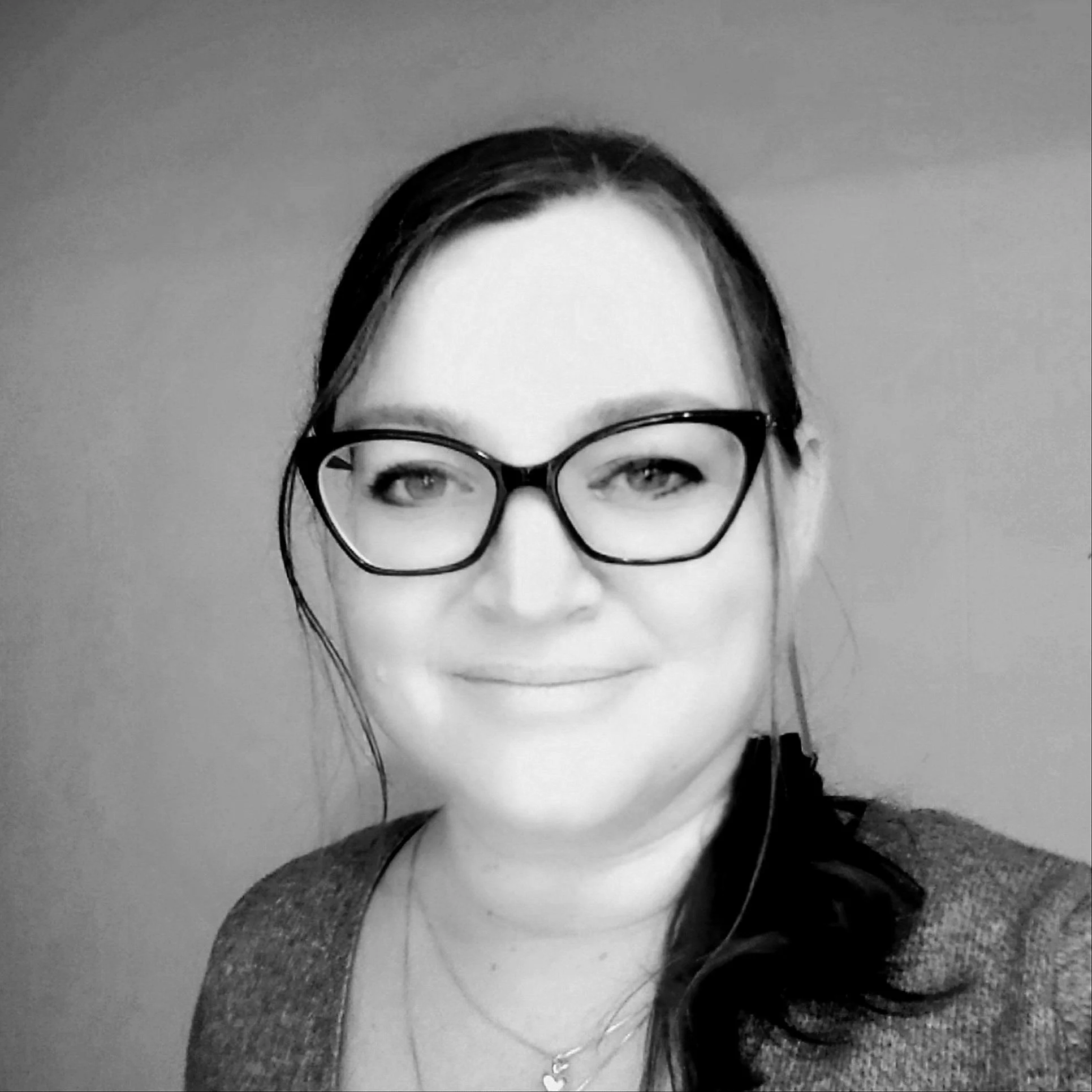 Black and white photo of our Founder, Kate Lewis-Buckley.