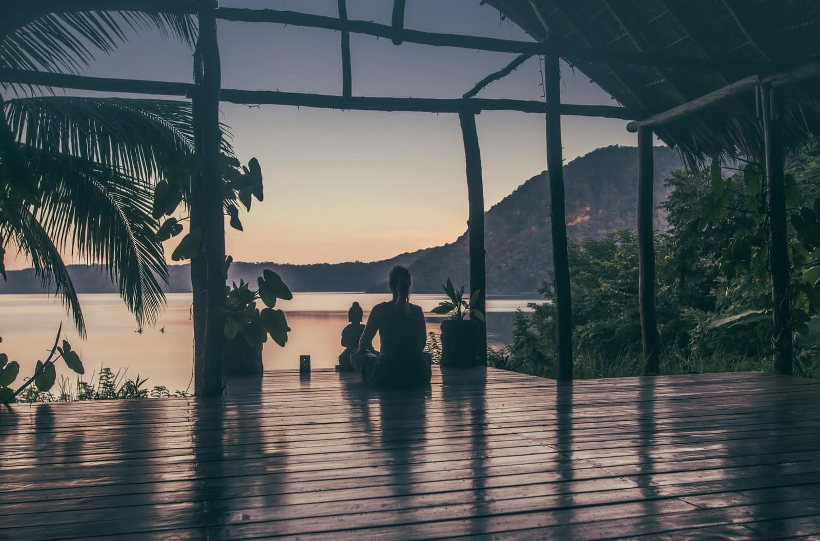 Sunset over Laguna de Apoyo, Nicaragua, viewed from Villa Laguna’s waterfront multi-purpose deck, perfect for yoga and relaxation.