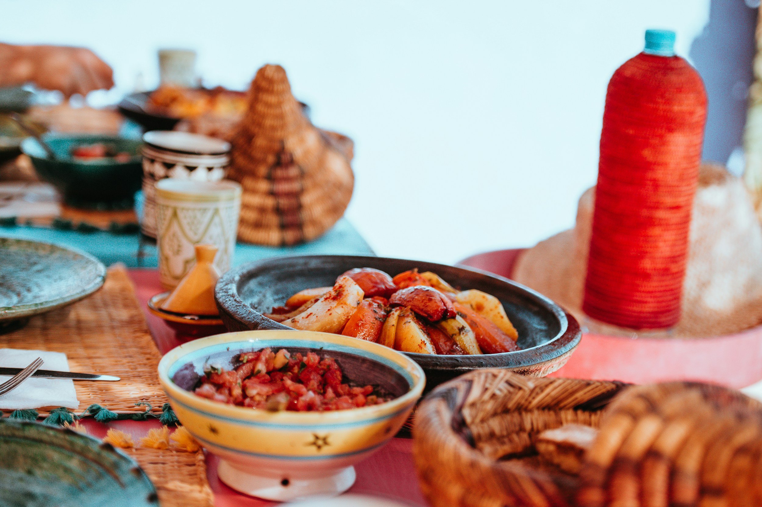 Traditional Moroccan dishes served as part of a Morocco yoga retreat and cooking experience.