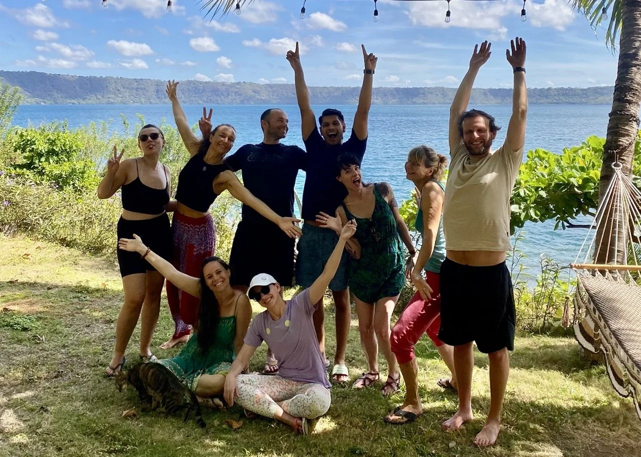 Guests from a yoga retreat smiling and posing in the garden at Villa Laguna, Nicaragua