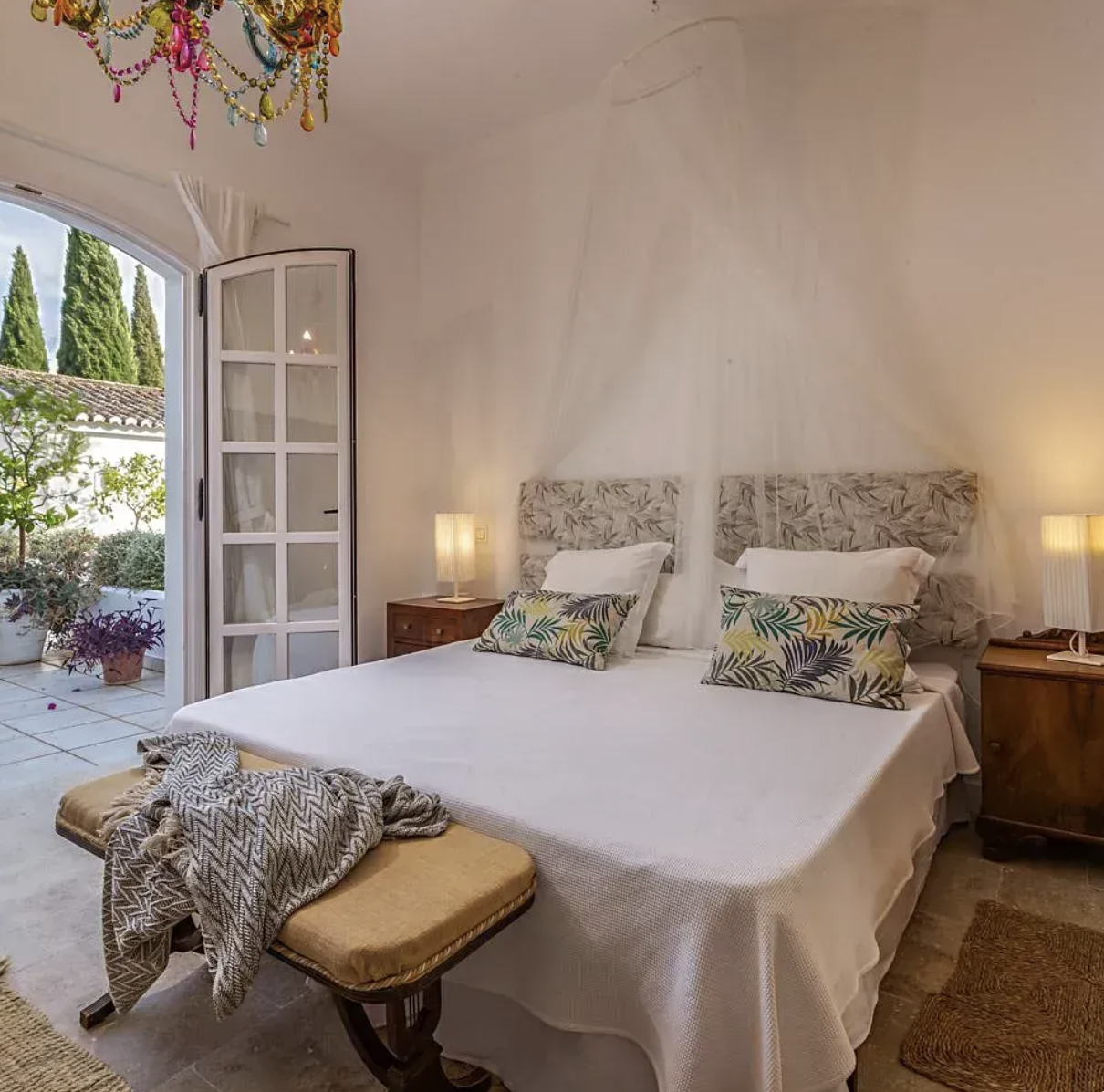 Elegant villa bedroom with garden access, providing peaceful accommodation for the yoga and walking retreat in Andalusia.