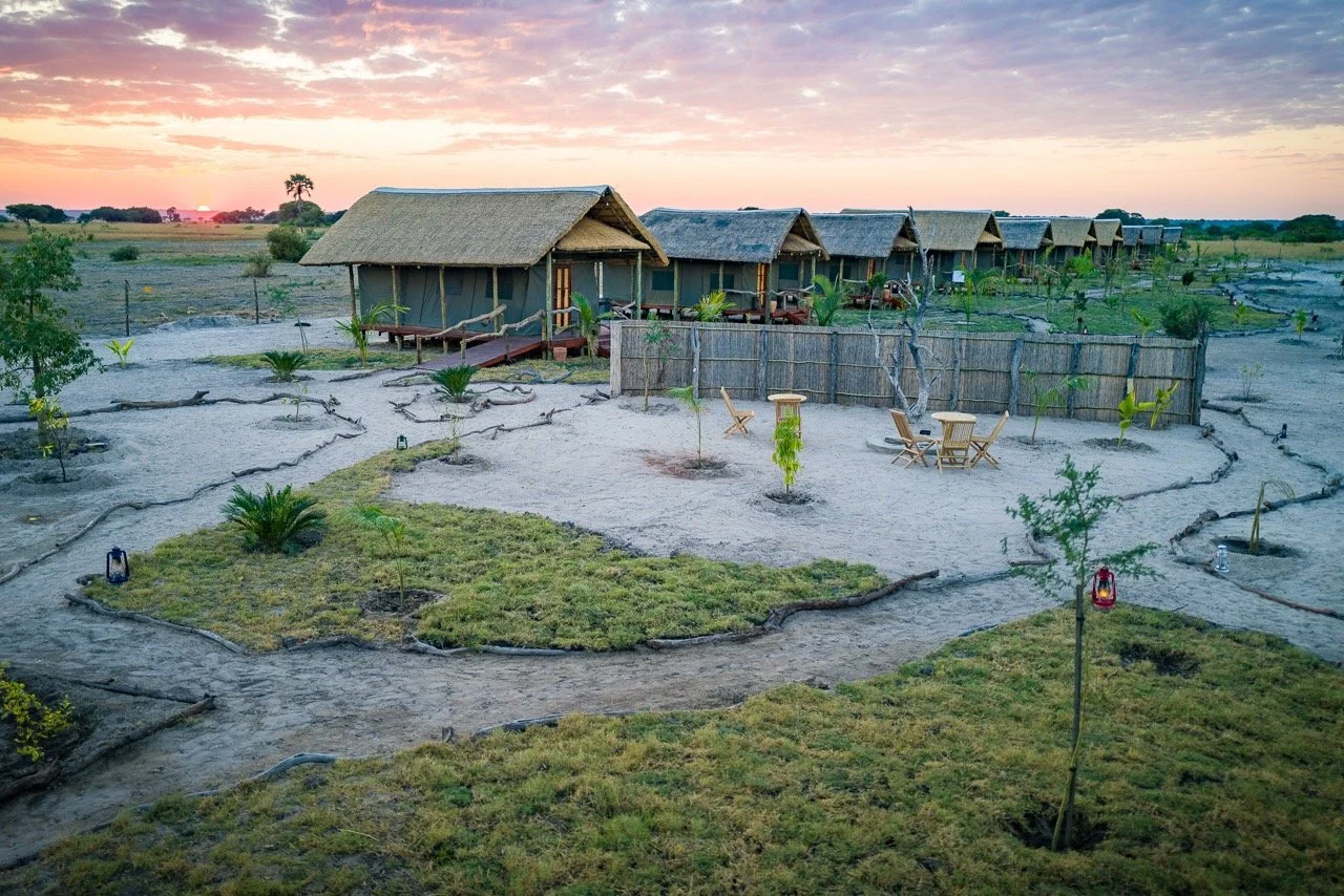 Aerial view of Munga Plains yoga safari camp surrounded by the open landscape of Chobe National Park in Botswana